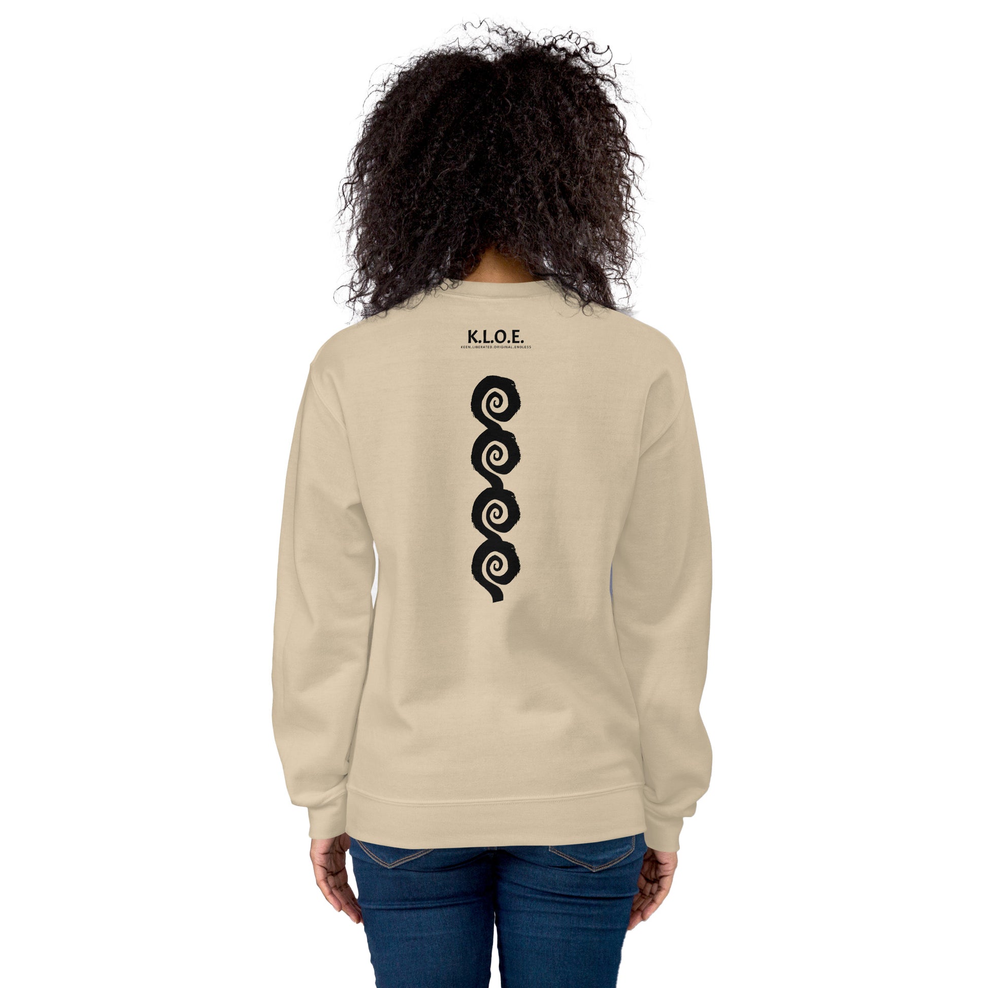 Back view of sand color K.L.O.E. sweatshirt showcasing a bold, hand-drawn black spiral design symbolising creativity and individuality, with the K.L.O.E. logo above, reflecting modern bohemian style and artistic self-expression, worn by a model.