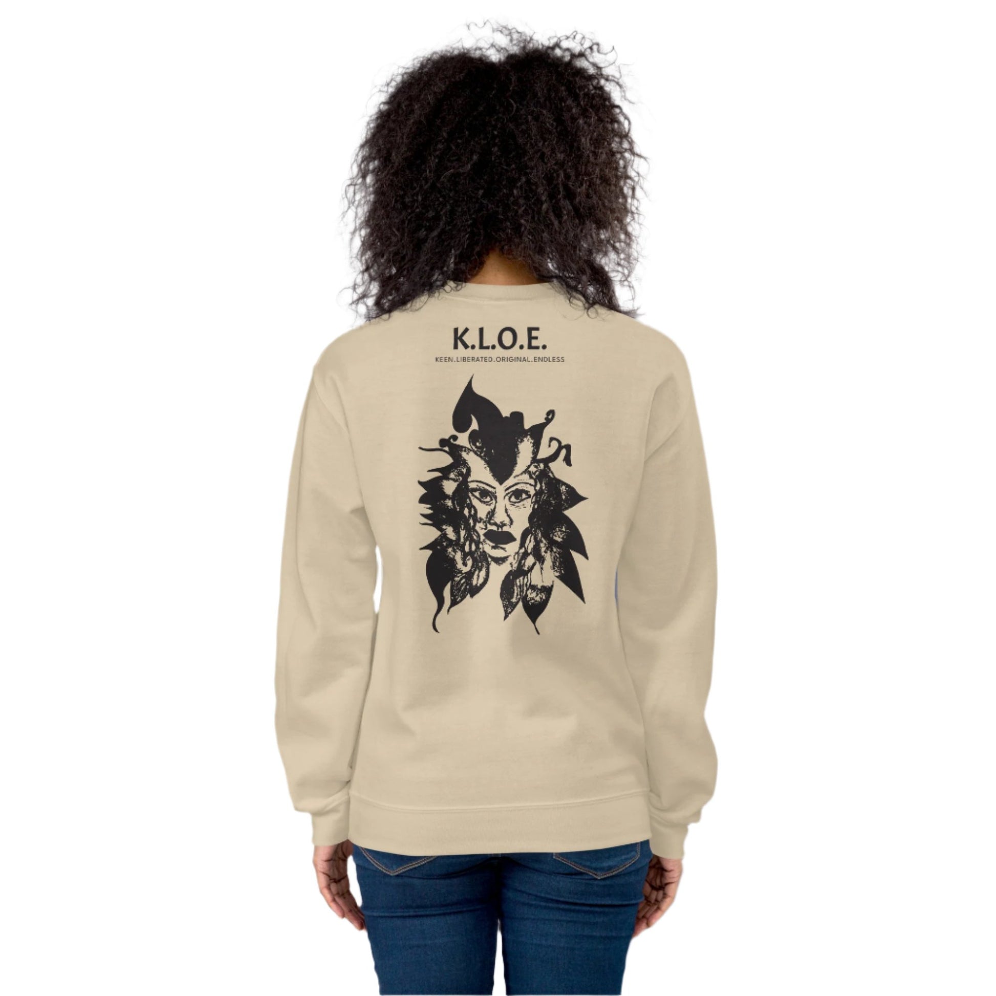 Back view of a sand K.L.O.E. sweatshirt showcasing a culturally inspired, hand-drawn black design featuring a bold, expressive face intertwined with flowing, abstract patterns, and K.L.O.E. logo, embodying artistic self-expression and modern bohemian style fashion, on a model.