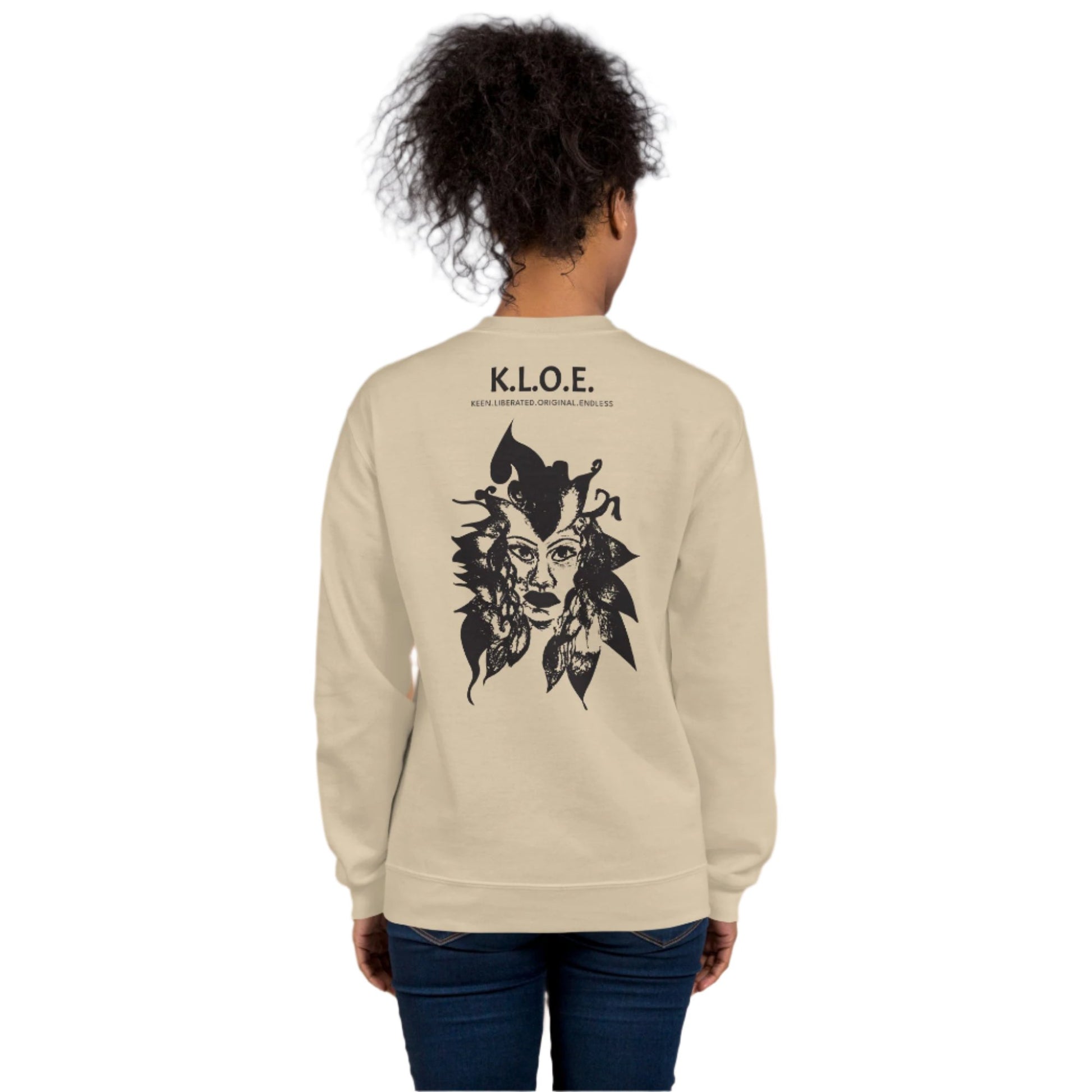 Back view of a sand K.L.O.E. sweatshirt showcasing a culturally inspired, hand-drawn black design featuring a bold, expressive face intertwined with flowing, abstract patterns, and K.L.O.E. logo, embodying artistic self-expression and modern bohemian style fashion, on a model.