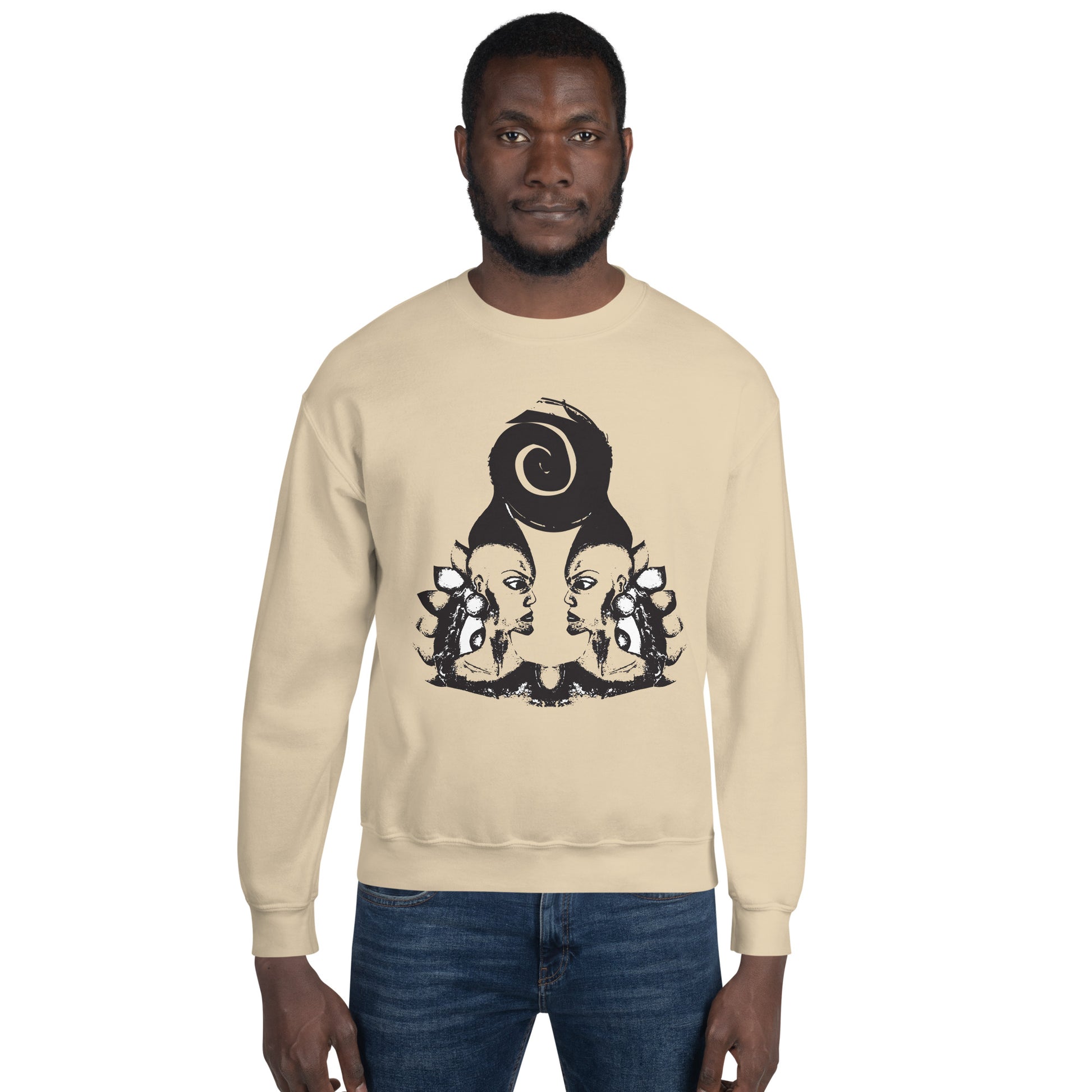 A male model wearing sand color K.L.O.E. sweatshirt featuring a culturally inspired, hand-drawn design of two mirrored faces in bold black, showcasing unique artistry and self-expression in modern bohemian style clothing.