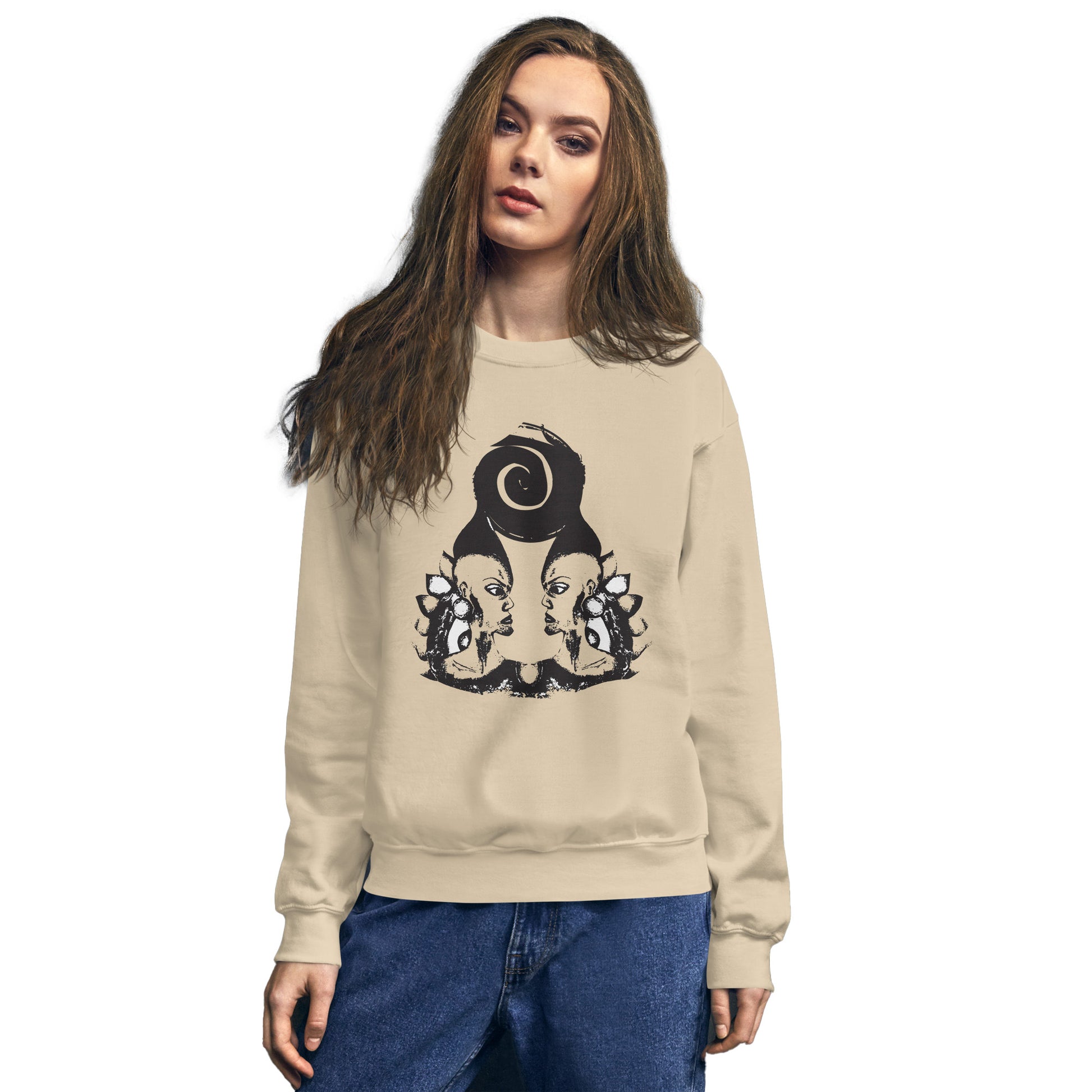 A model wearing sand color K.L.O.E. sweatshirt featuring a culturally inspired, hand-drawn design of two mirrored faces in bold black, showcasing unique artistry and self-expression in modern bohemian style clothing.