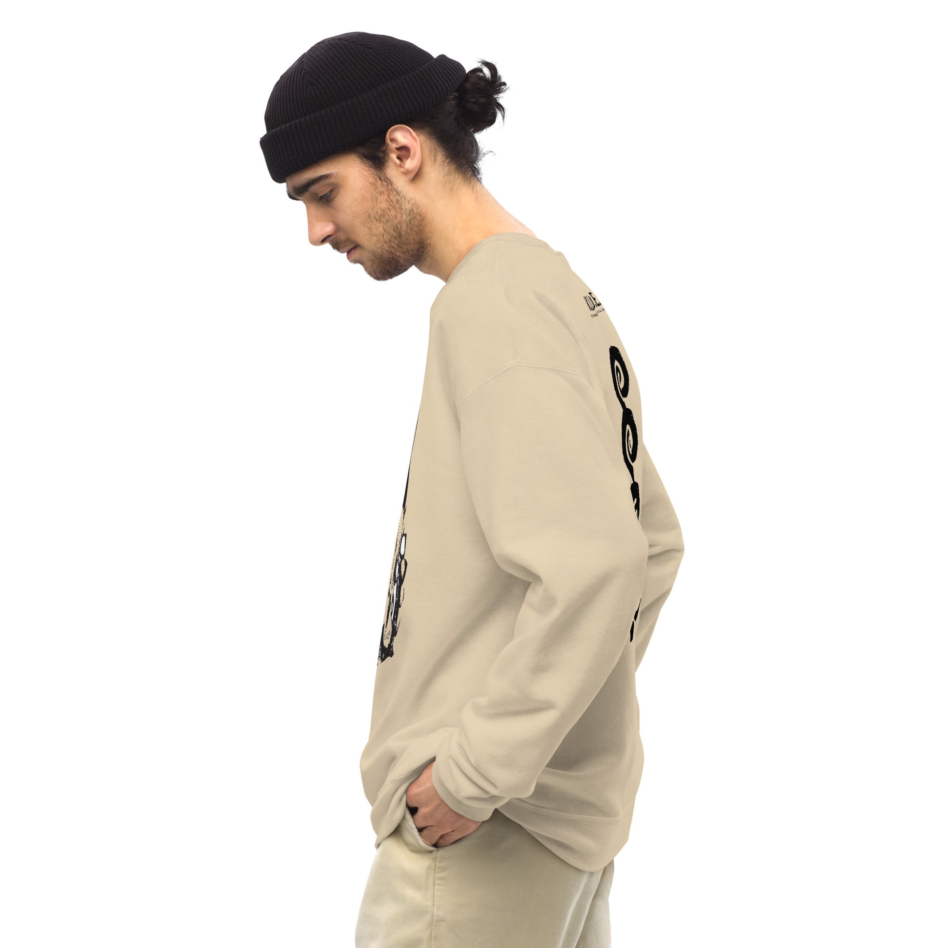 Side view of sand color K.L.O.E. sweatshirt showcasing a bold, hand-drawn black spiral design symbolising creativity and individuality, with the K.L.O.E. logo above, reflecting modern bohemian style and artistic self-expression, worn by a male model.