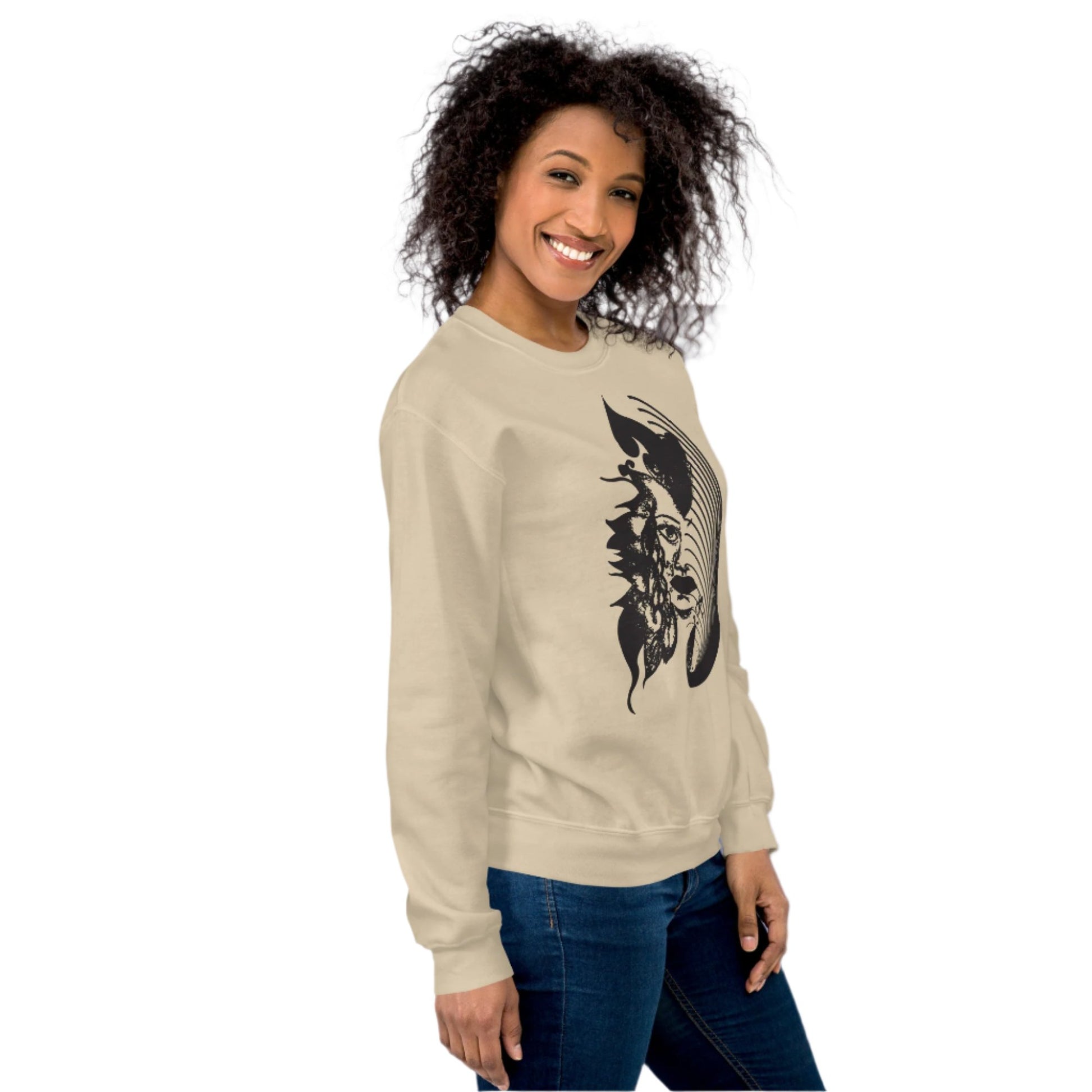  A model wearing sand K.L.O.E. sweatshirt featuring a culturally inspired, hand-drawn black graphic of a bold, expressive face surrounded by intricate details, celebrating individuality and artistic self-expression in modern bohemian style fashion.