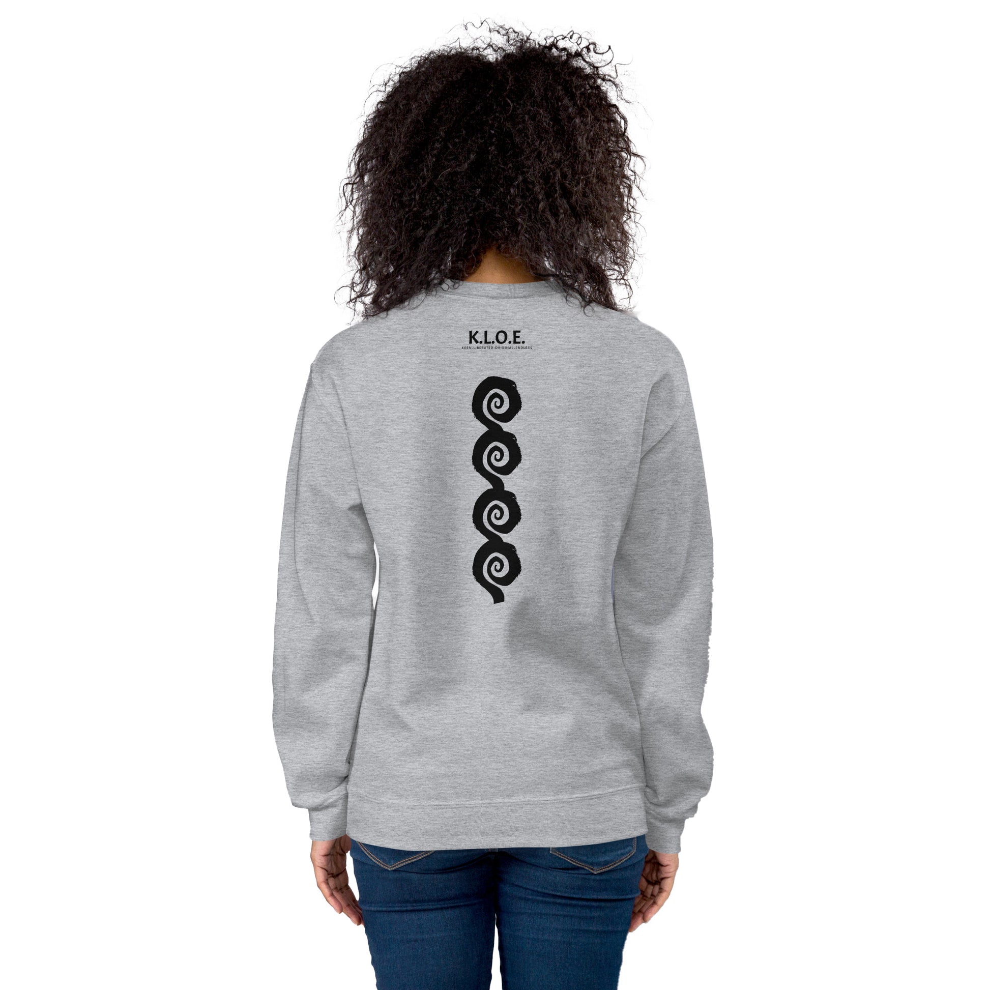 Back view of grey K.L.O.E. sweatshirt showcasing a bold, hand-drawn black spiral design symbolising creativity and individuality, with the K.L.O.E. logo above, reflecting modern bohemian style and artistic self-expression, worn by a model.