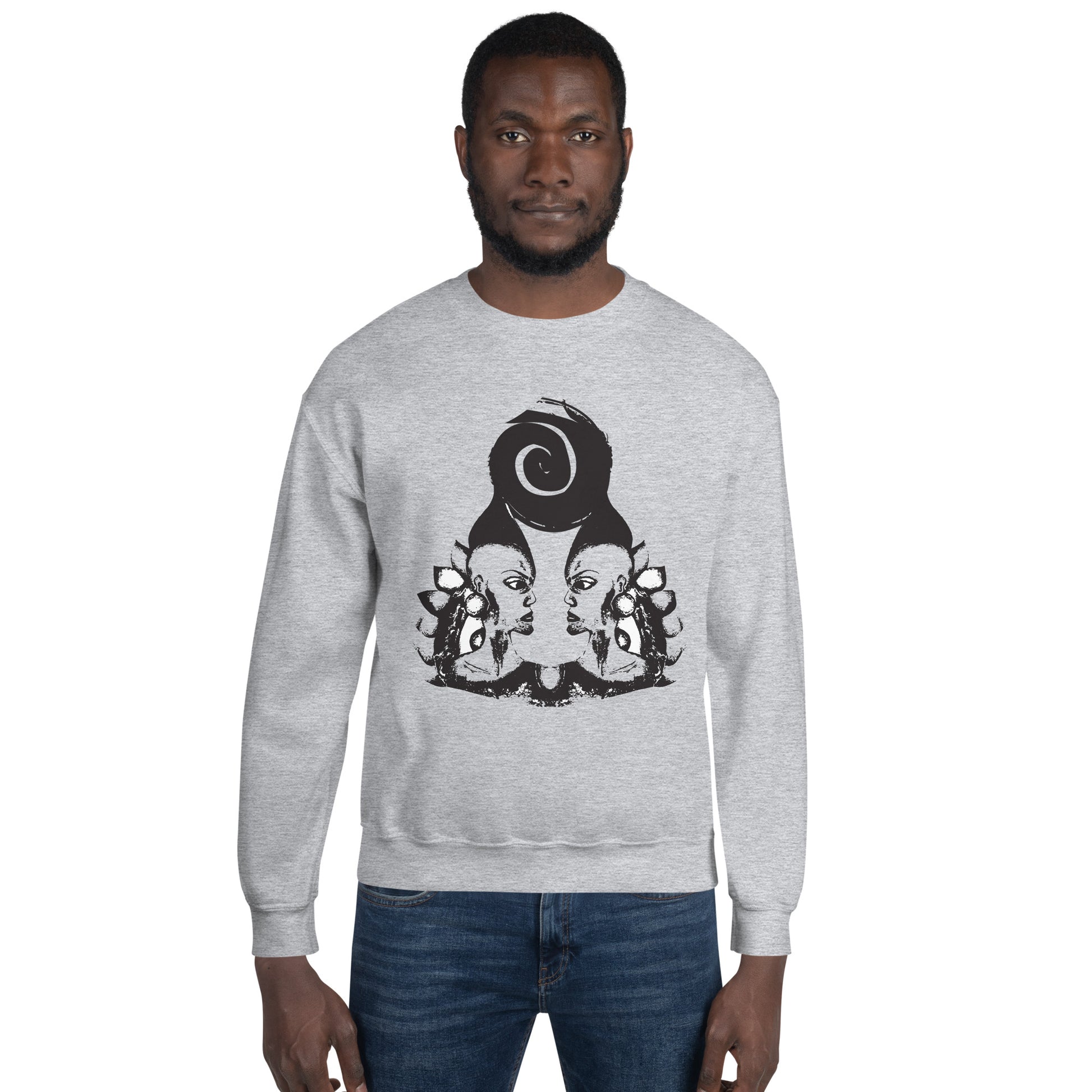 A male model wearing grey K.L.O.E. sweatshirt featuring a culturally inspired, hand-drawn design of two mirrored faces in bold black, showcasing unique artistry and self-expression in modern bohemian style clothing.