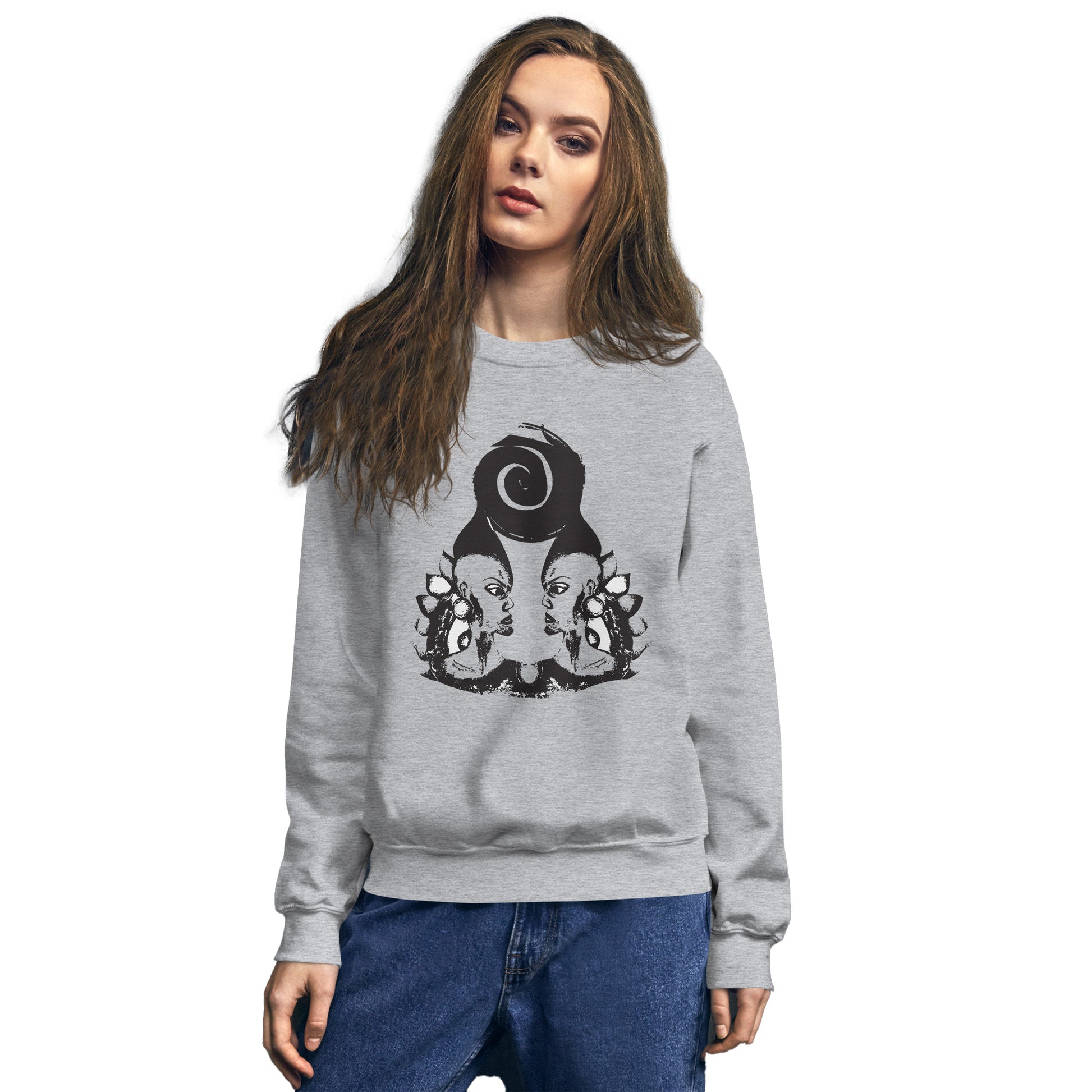 A model wearing grey K.L.O.E. sweatshirt featuring a culturally inspired, hand-drawn design of two mirrored faces in bold black, showcasing unique artistry and self-expression in modern bohemian style clothing.