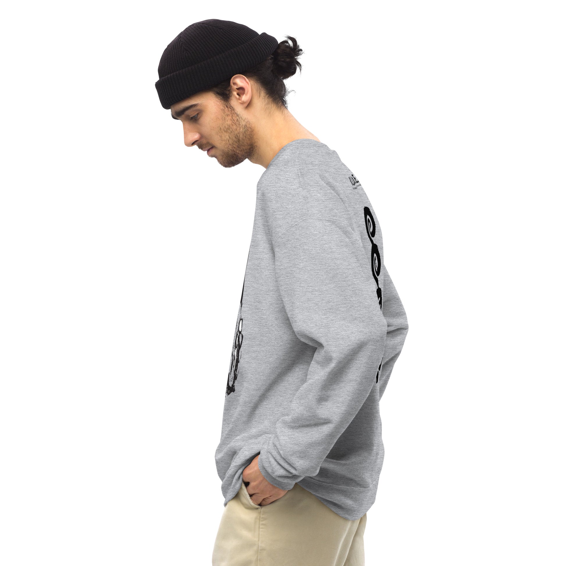 Side view of grey K.L.O.E. sweatshirt showcasing a bold, hand-drawn black spiral design symbolising creativity and individuality, with the K.L.O.E. logo above, reflecting modern bohemian style and artistic self-expression, worn by a male model.
