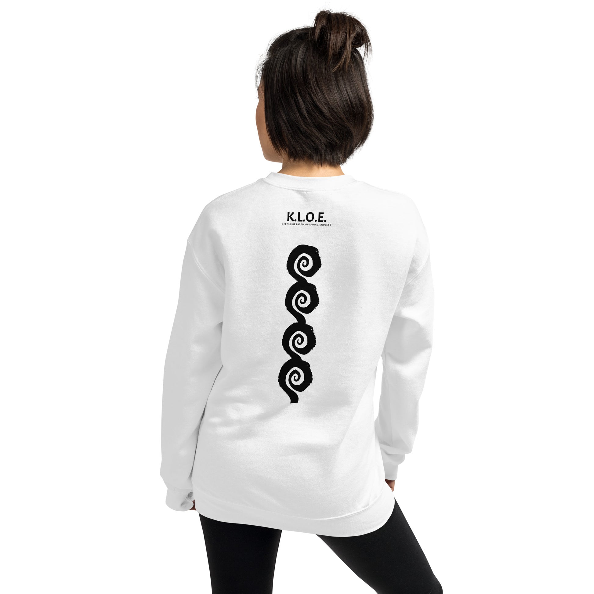 Back view of white K.L.O.E. sweatshirt showcasing a bold, hand-drawn black spiral design symbolising creativity and individuality, with the K.L.O.E. logo above, reflecting modern bohemian style and artistic self-expression, worn by a model.