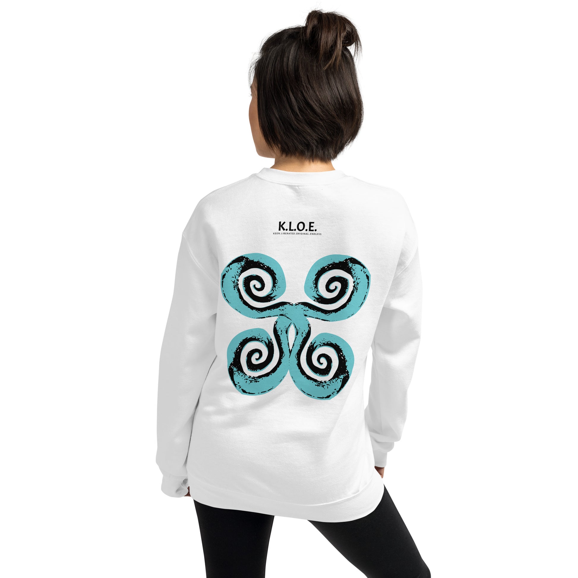 The back of the white K.L.O.E. sweatshirt featuring a culturally inspired, hand-drawn design of bold black and teal spirals, symbolizing self-expression, individuality, and modern bohemian style, worn by a model.
