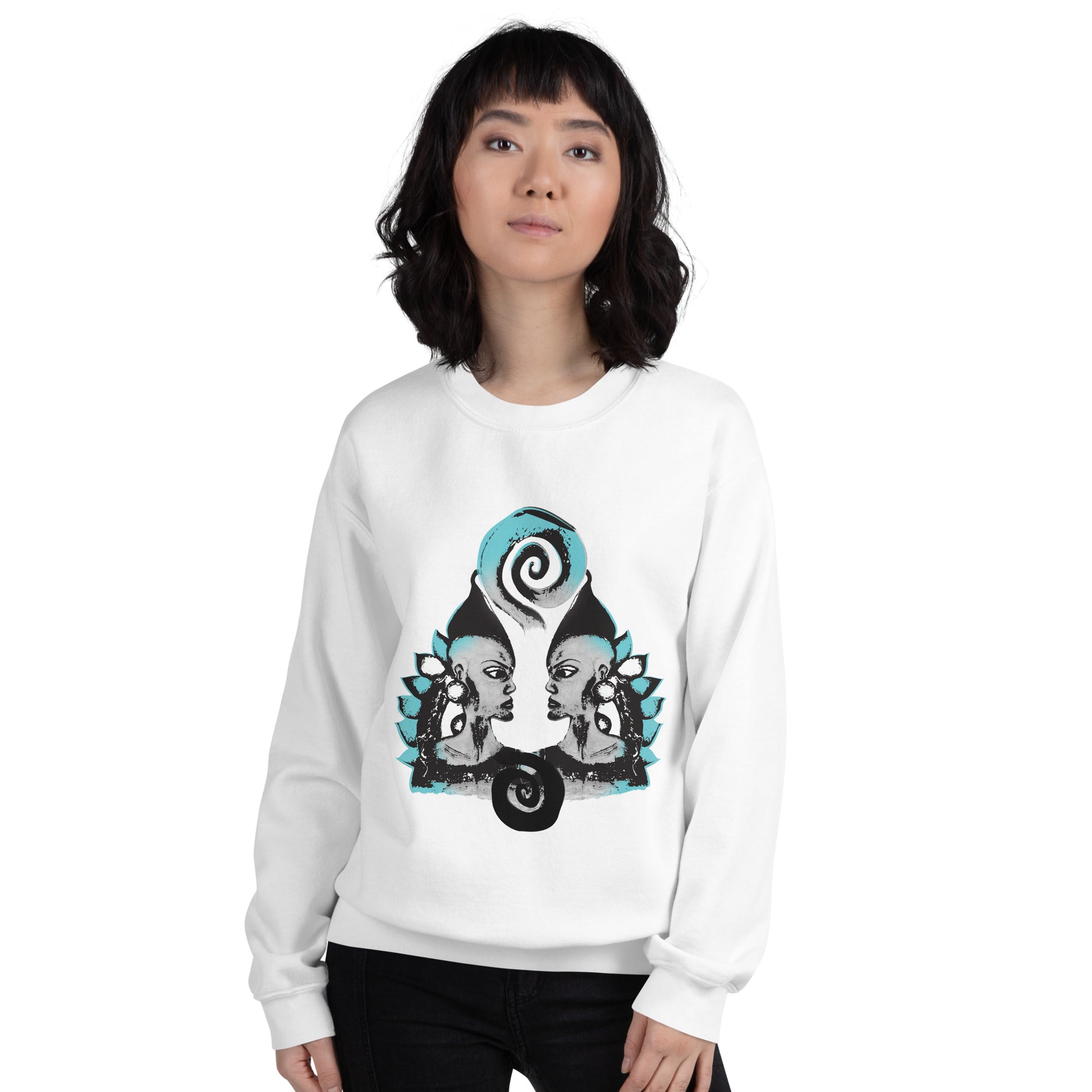 The model wearing white K.L.O.E. sweatshirt with a culturally inspired, hand-drawn design of two mirrored faces in bold black and teal, celebrating self-expression and individuality in modern bohemian style clothing.