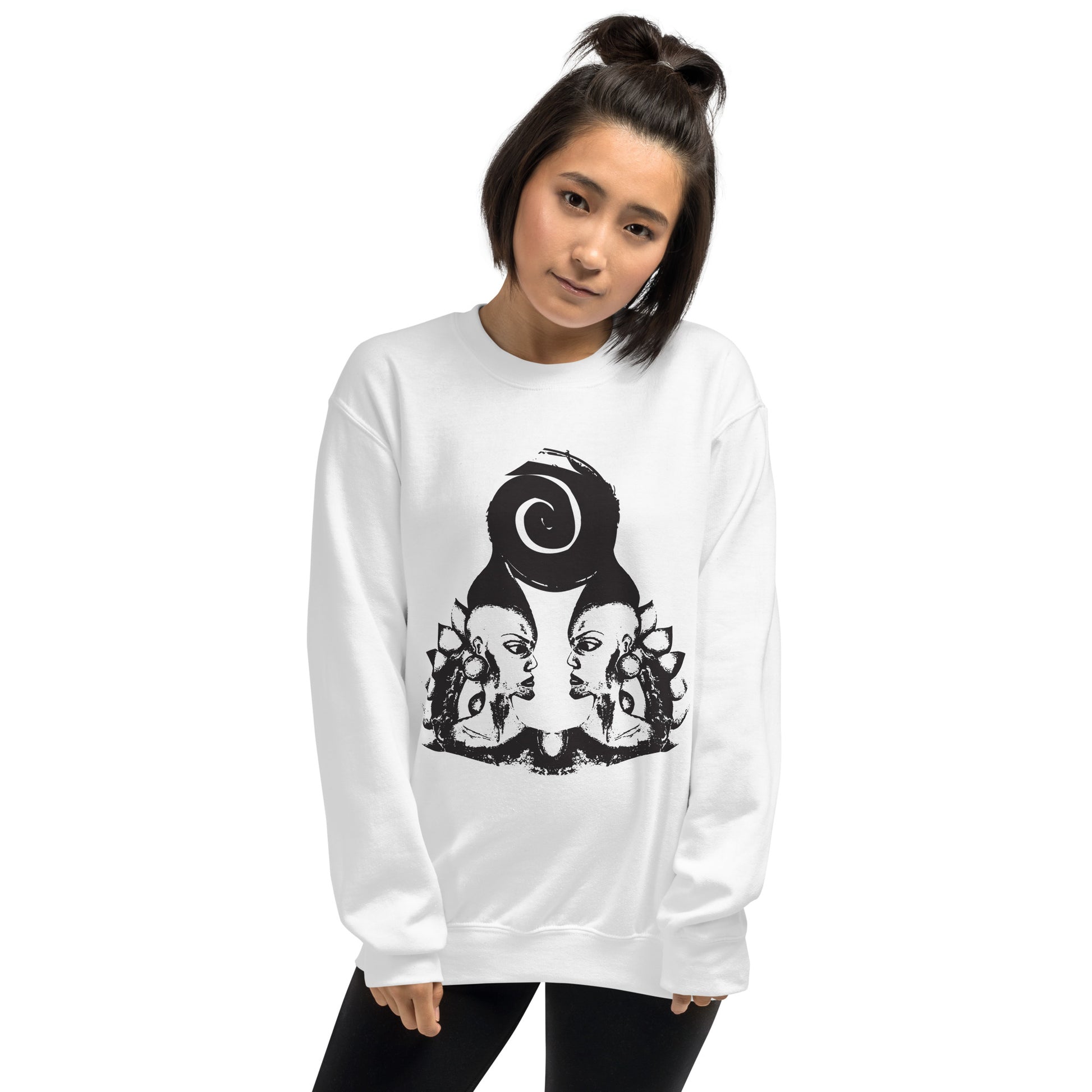 A model wearing white K.L.O.E. sweatshirt featuring a culturally inspired, hand-drawn design of two mirrored faces in bold black, showcasing unique artistry and self-expression in modern bohemian style clothing.