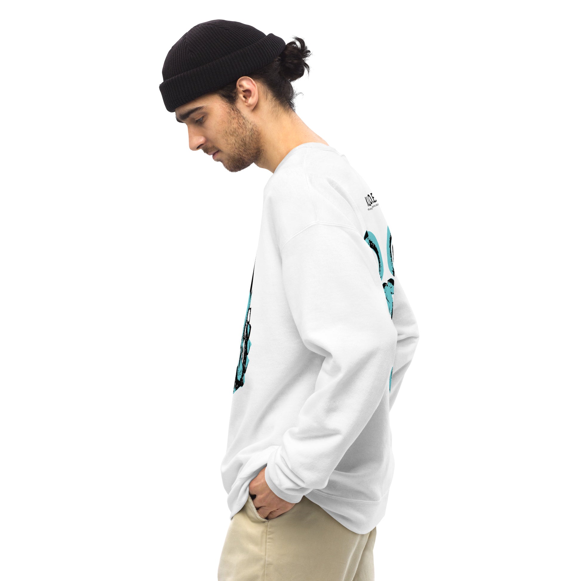 Side view of a male model wearing the white K.L.O.E. sweatshirt featuring a hand-drawn design of two mirrored faces in bold black and teal, showcasing cultural inspiration, individuality, and modern bohemian style self-expression.