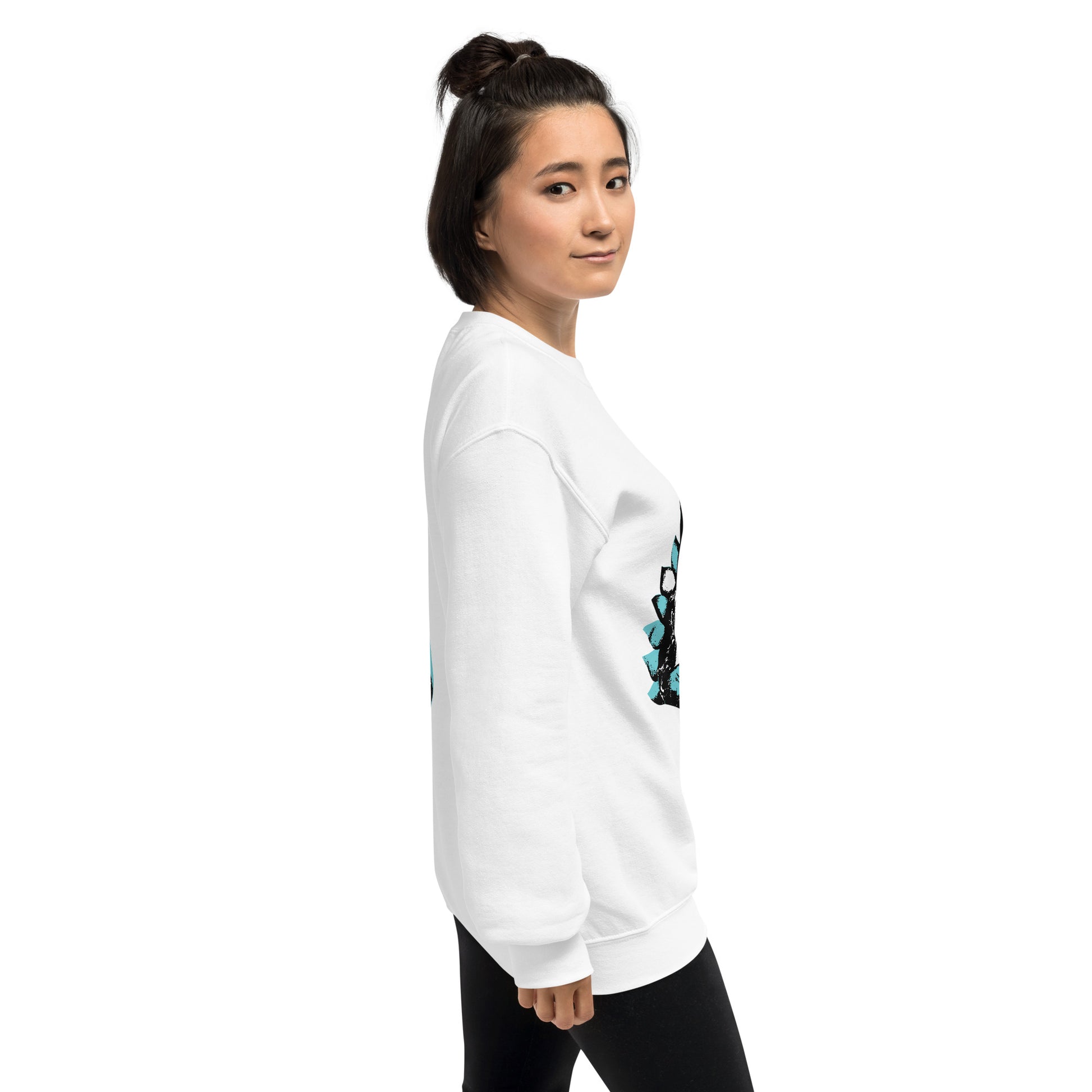 A model wearing the white K.L.O.E. sweatshirt featuring a hand-drawn design of two mirrored faces in bold black and teal, showcasing cultural inspiration, individuality, and modern bohemian style self-expression.