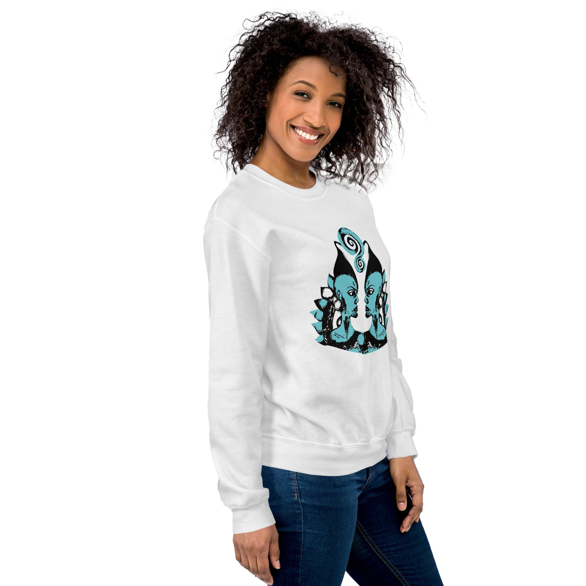 A model wearing the white K.L.O.E. sweatshirt featuring a hand-drawn design of two mirrored faces in bold black and teal, showcasing cultural inspiration, individuality, and modern bohemian style self-expression.