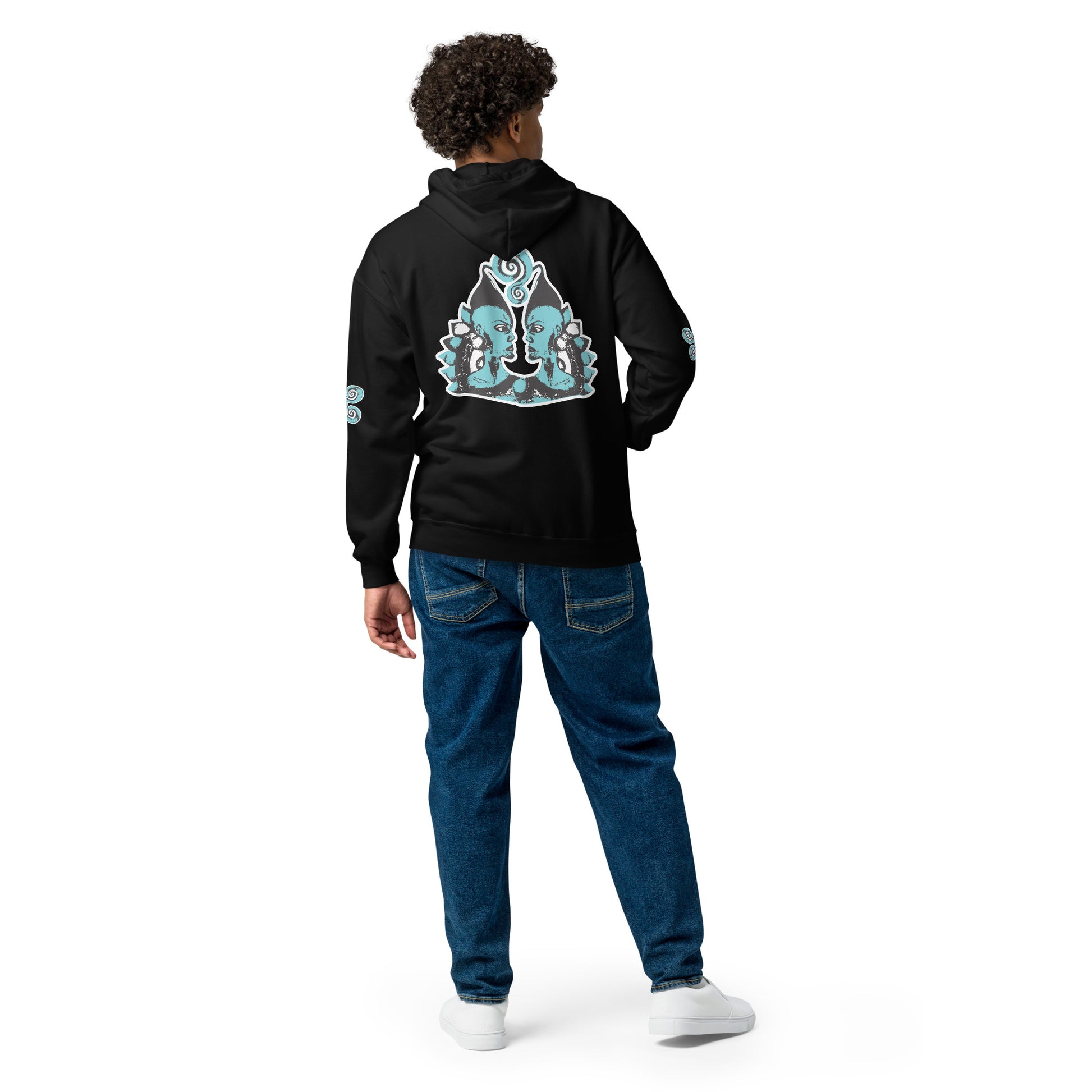 The model wearing black zip-up hoodie featuring a striking, hand-drawn graphic on the back of two mirrored female figures with intricate headpieces in black and teal, connected by a central spiral element, on the back. Teal spiral accents appear on each sleeve, adding a touch of cultural artistry. This K.L.O.E. design embodies modern boho style and expressive, artisan-crafted fashion, ideal for those who embrace unique, eco-friendly apparel and global inspiration.