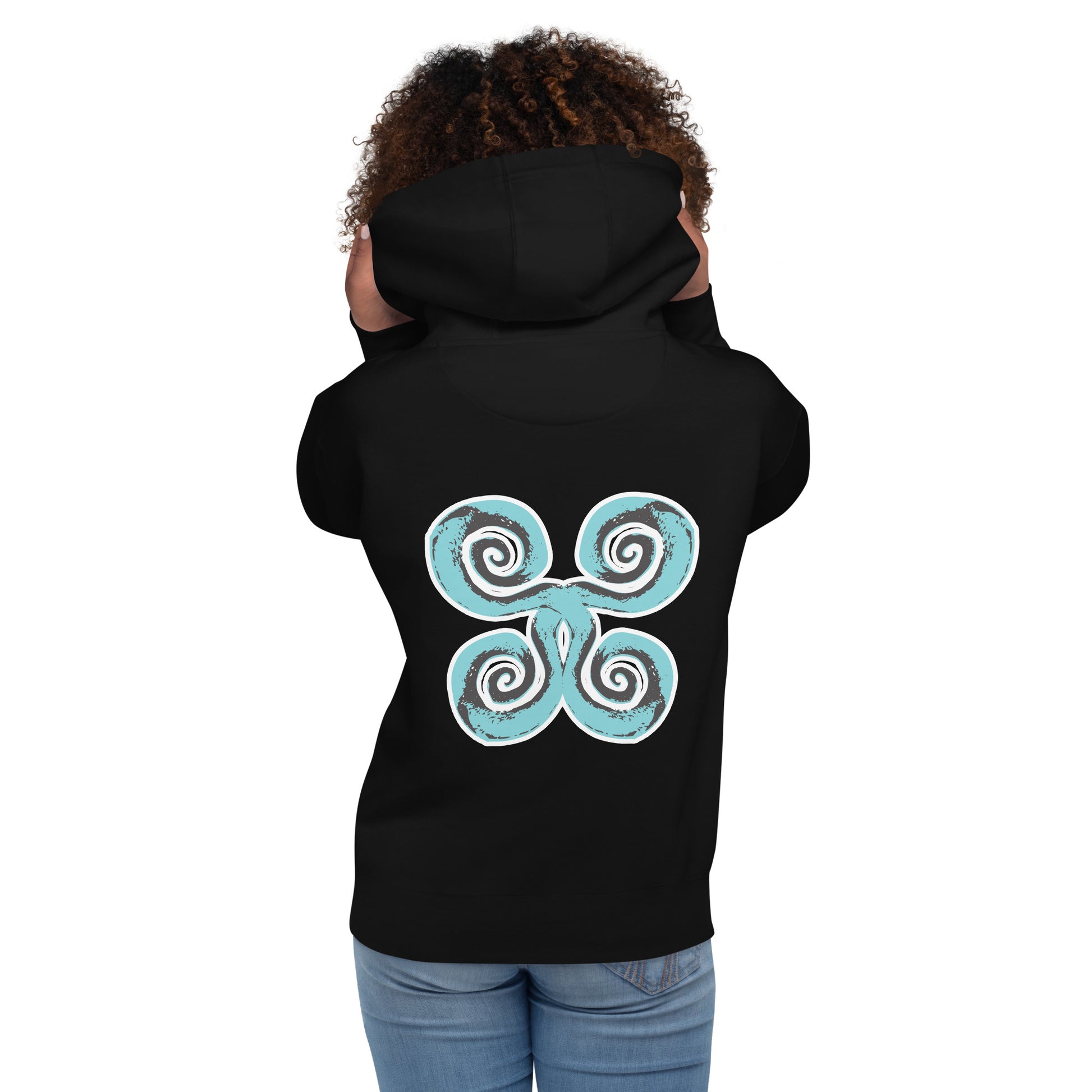 Back side view of the black K.L.O.E. hoodie showcasing a bold, hand-drawn spiral design in teal and white, symbolizing creativity and individuality, embodying culturally inspired, modern bohemian style and artistic expression with eco-friendly fashion values, worn by a model.