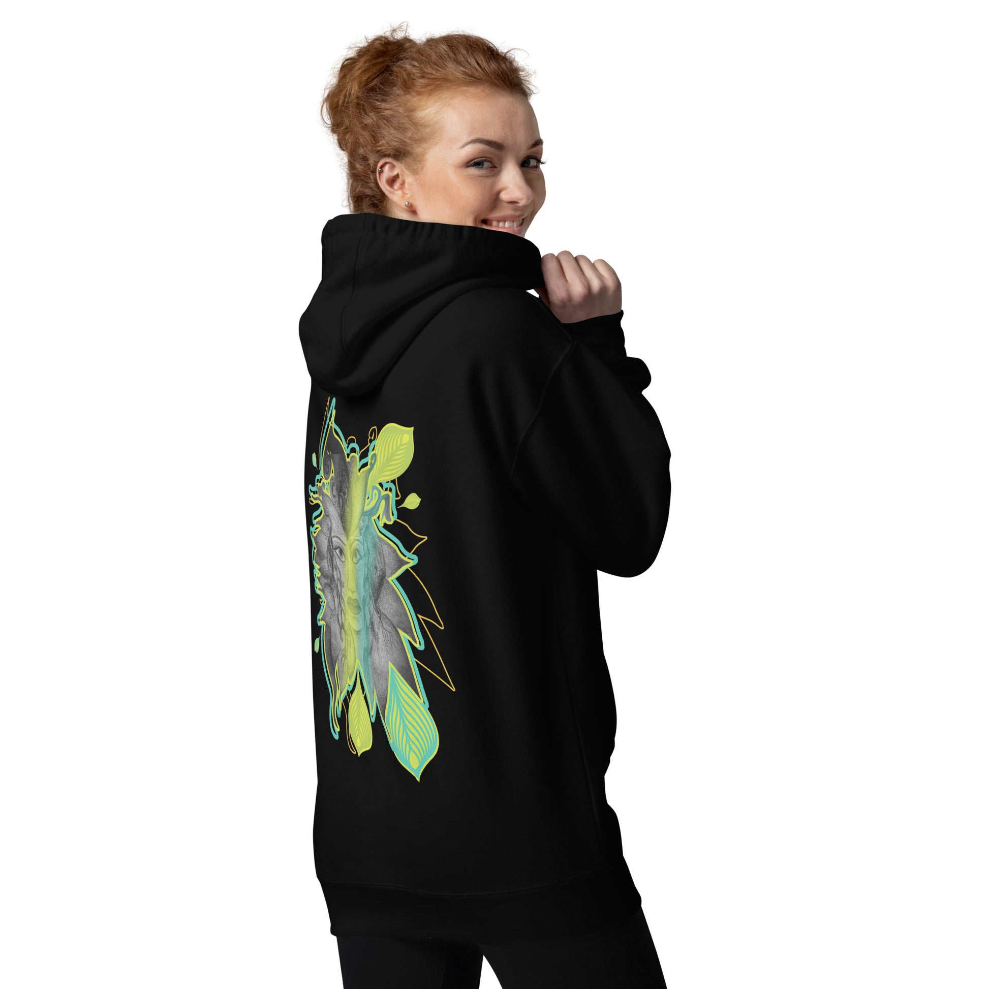 Back view of K.L.O.E. black hoodie featuring a bold hand-drawn face design framed by vibrant green and yellow leaf patterns. A statement of modern bohemian style, artistic craftsmanship, and self-expression that celebrates individuality and culturally inspired fashion, on a model.