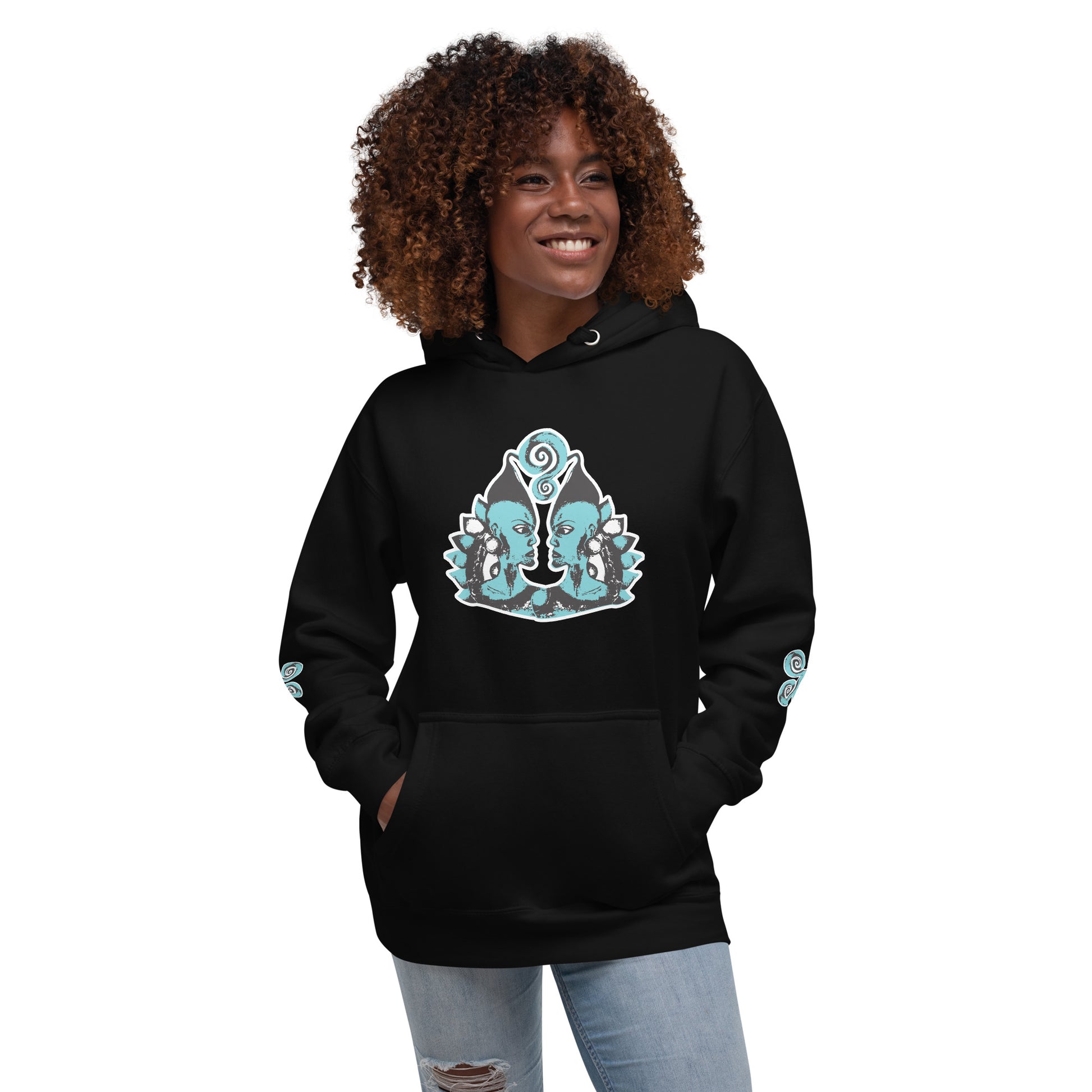 Front of black K.L.O.E. hoodie featuring a hand-drawn design of two mirrored faces in teal and white, highlighting culturally inspired, bohemian style fashion with a focus on individuality, artistic expression, and modern eco-friendly fashion, worn by a model.