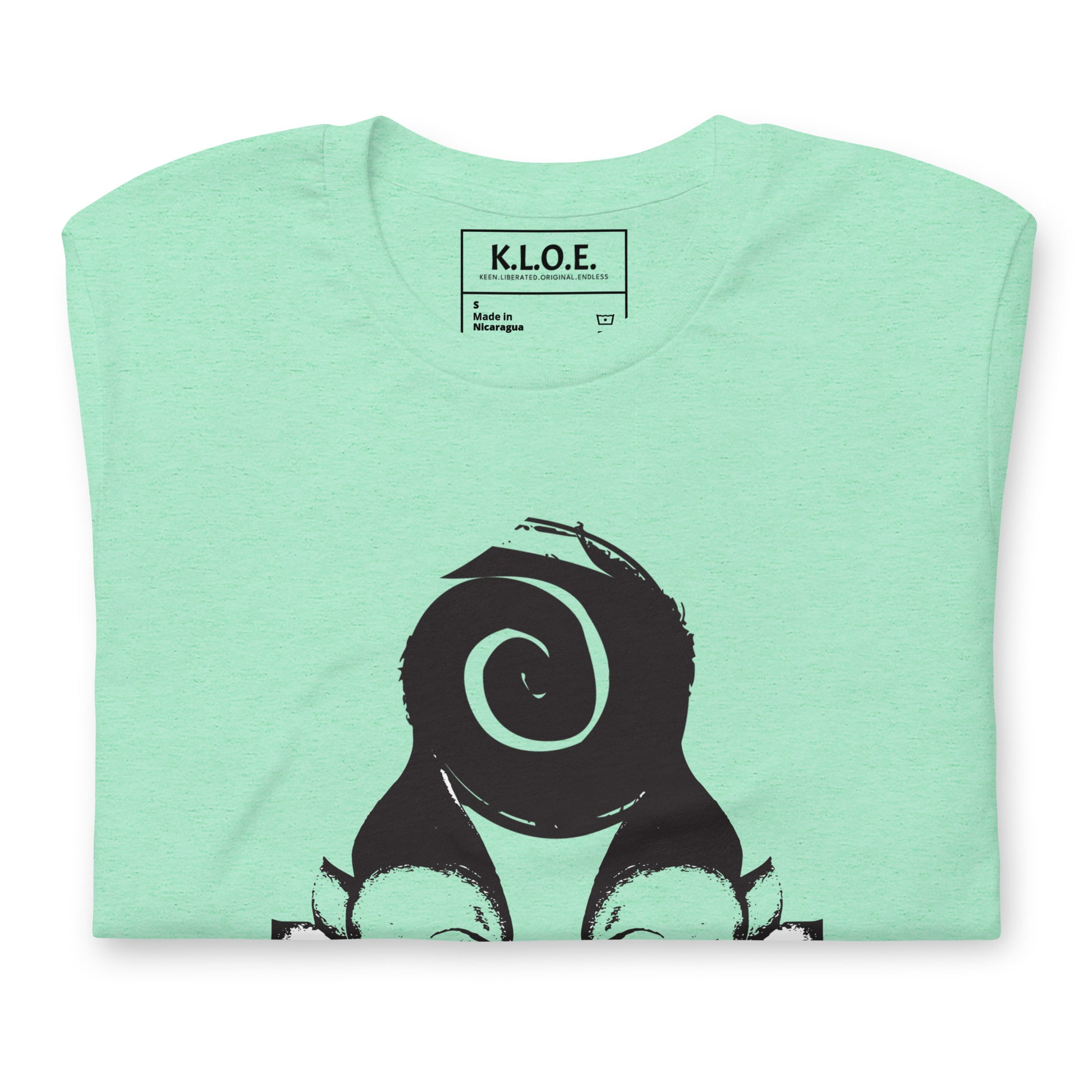 Mint t-shirt featuring wearable illustrations with an art-inspired black design of mirrored female faces and a bold central spiral symbol, celebrating expressive fashion and individuality – unique clothing by K.L.O.E., detail view showing the inside label.