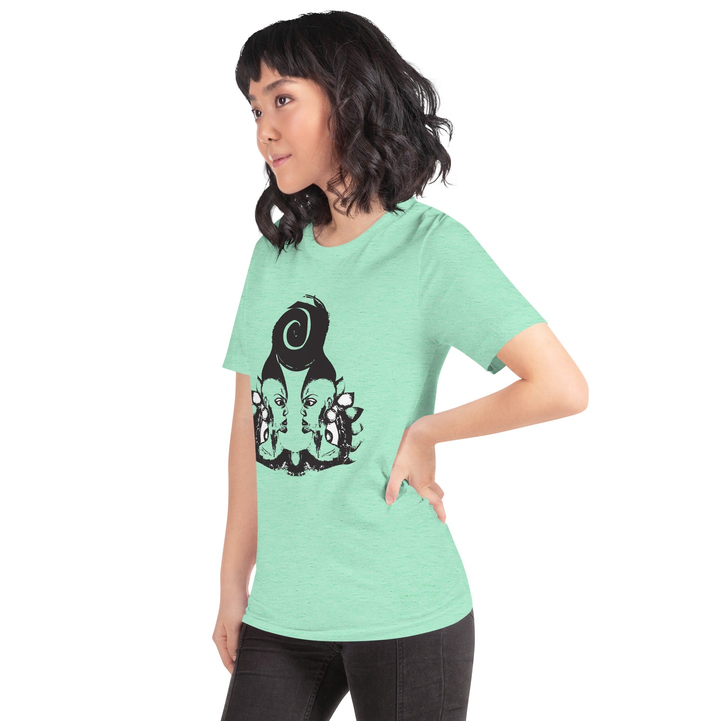 A model wearing mint t-shirt featuring wearable illustrations with an art-inspired black design of mirrored female faces and a bold central spiral symbol, celebrating expressive fashion and individuality – unique clothing by K.L.O.E.