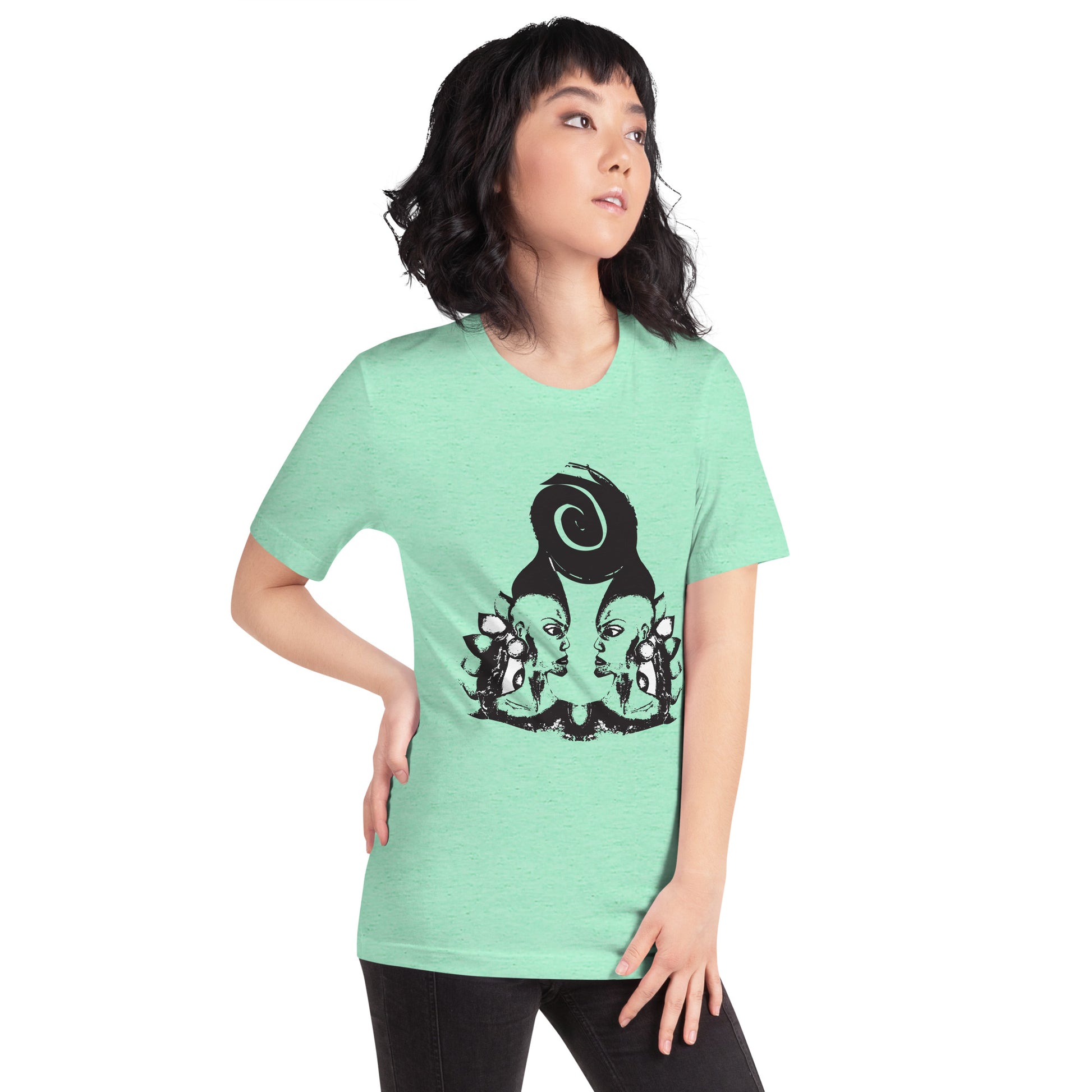 A model wearing mint t-shirt featuring wearable illustrations with an art-inspired black design of mirrored female faces and a bold central spiral symbol, celebrating expressive fashion and individuality – unique clothing by K.L.O.E.