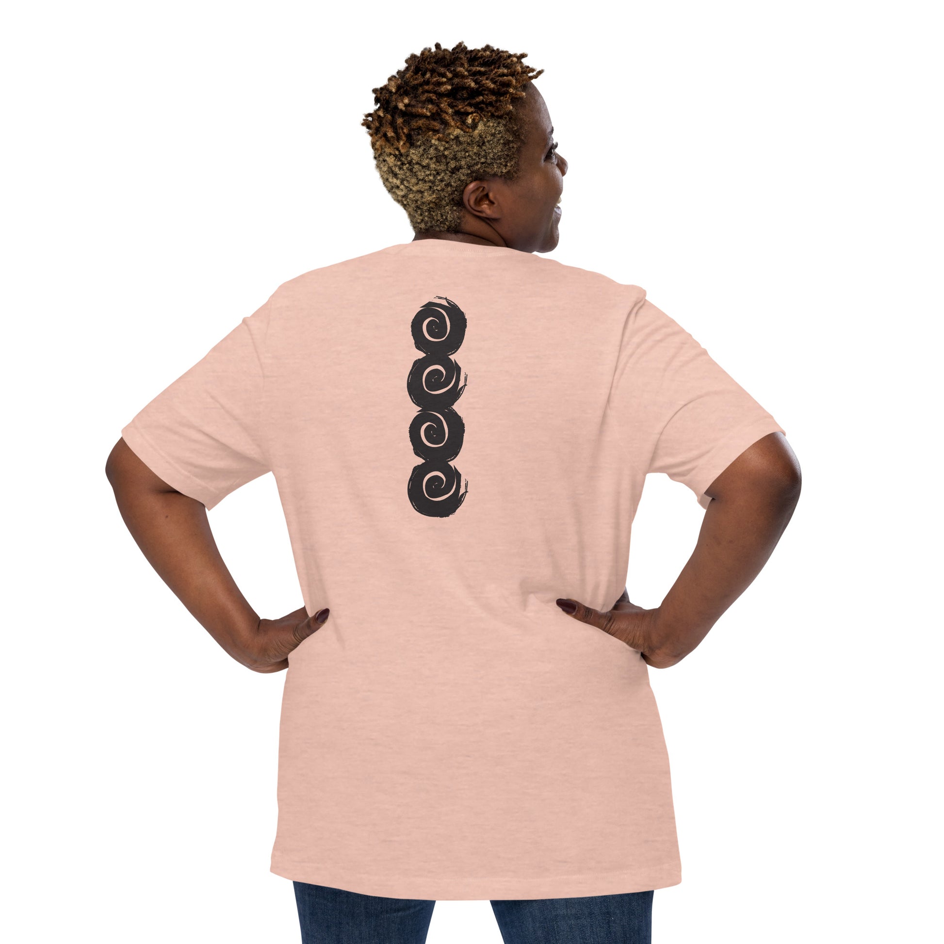 Back of a peach color t-shirt featuring a vertical row of four bold, black spiral symbols, hand-drawn in an expressive, brushstroke style. This culturally inspired design from K.L.O.E. highlights artisan craftsmanship and modern boho style, perfect for those who seek unique, eco-friendly fashion and artistic self-expression, worn by a plus size model.
