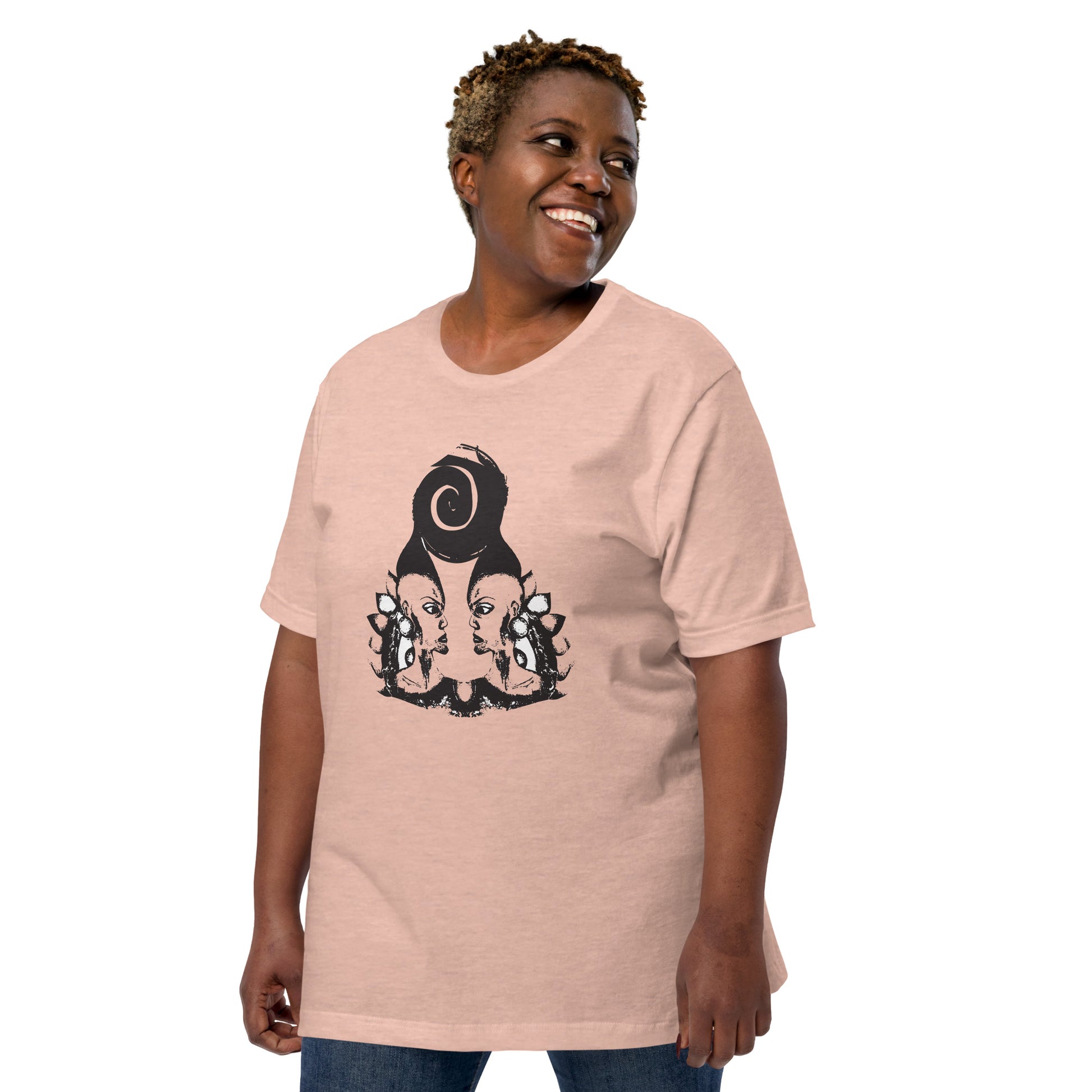 A plus size model wearing peach color t-shirt featuring wearable illustrations with an art-inspired black design of mirrored female faces and a bold central spiral symbol, celebrating expressive fashion and individuality – unique clothing by K.L.O.E.