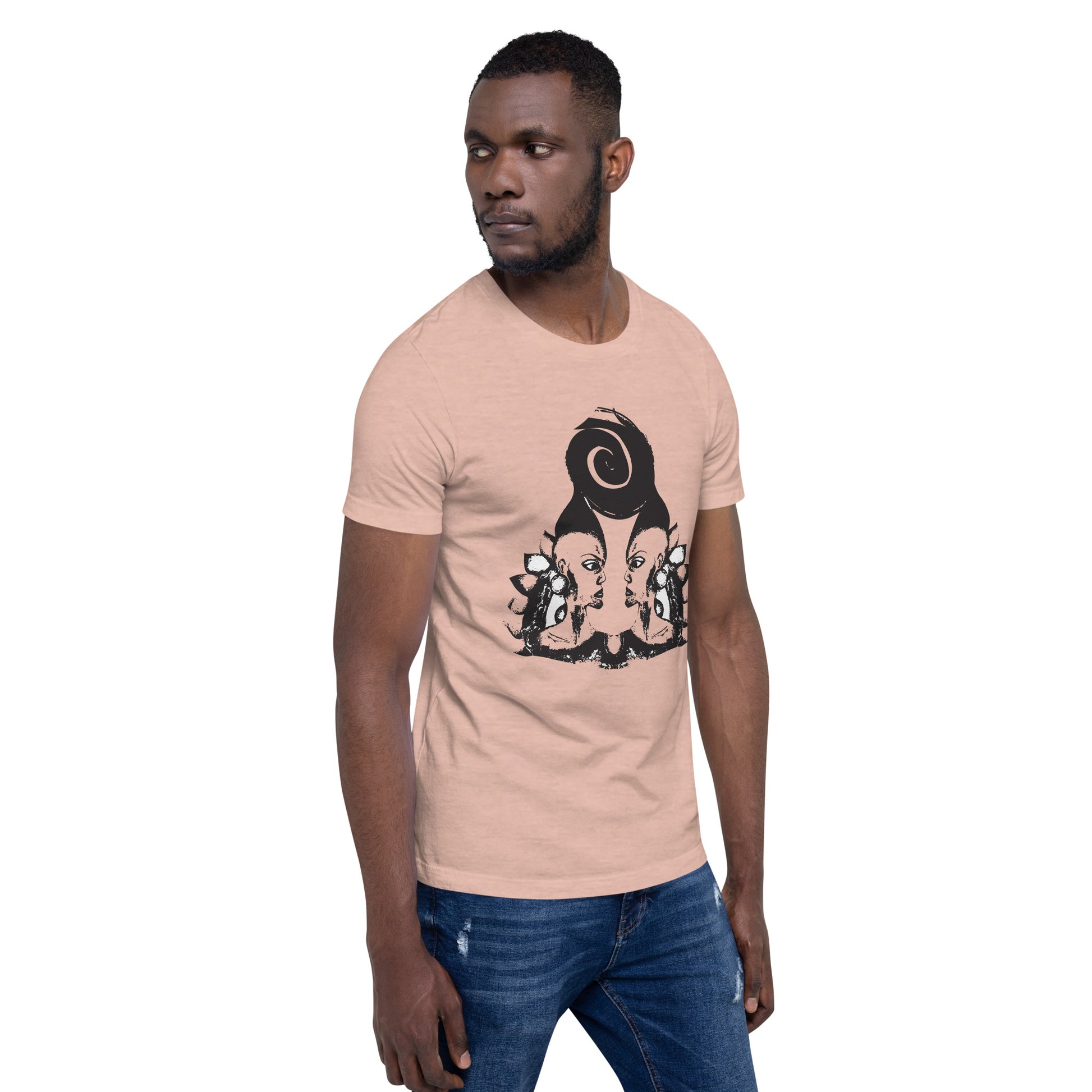A male model wearing peach color t-shirt featuring wearable illustrations with an art-inspired black design of mirrored female faces and a bold central spiral symbol, celebrating expressive fashion and individuality – unique clothing by K.L.O.E.