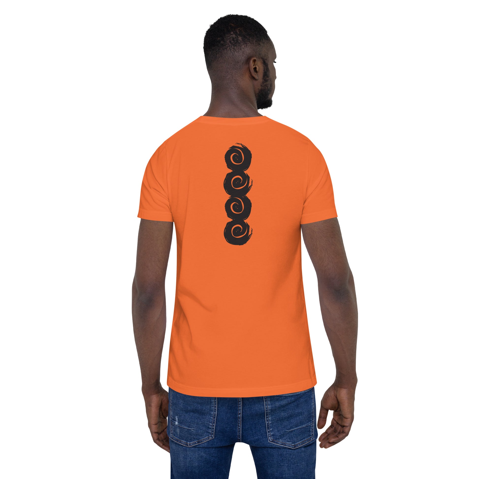 Back of an orange t-shirt featuring a vertical row of four bold, black spiral symbols, hand-drawn in an expressive, brushstroke style. This culturally inspired design from K.L.O.E. highlights artisan craftsmanship and modern boho style, perfect for those who seek unique, eco-friendly fashion and artistic self-expression, worn by a male model.