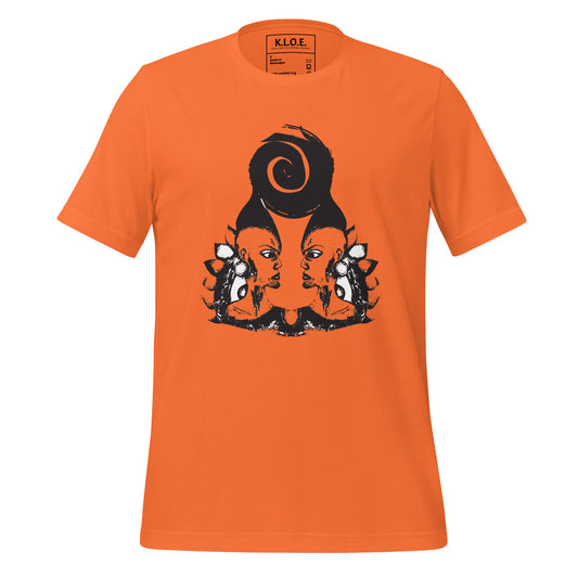 Orange t-shirt featuring a hand-drawn black ink design of two mirrored female figures with bold, intricate headpieces, connected by a swirling central element. This artistic piece from K.L.O.E. embraces cultural inspiration and self-expression, crafted for those who appreciate unique, expressive fashion and modern bohemian style.