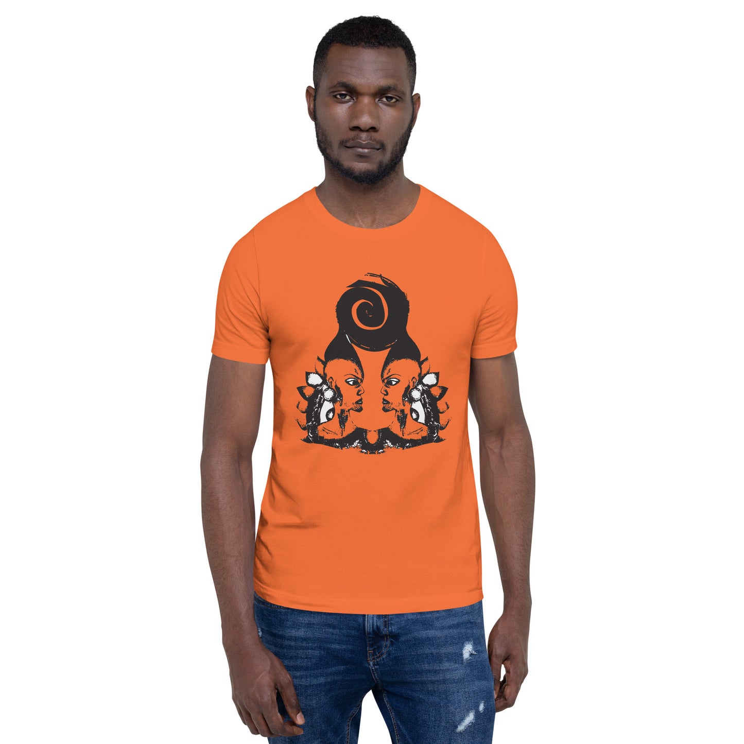 A male model wearing orange t-shirt featuring a hand-drawn black ink design of two mirrored female figures with bold, intricate headpieces, connected by a swirling central element. This artistic piece from K.L.O.E. embraces cultural inspiration and self-expression, crafted for those who appreciate unique, expressive fashion and modern bohemian style.