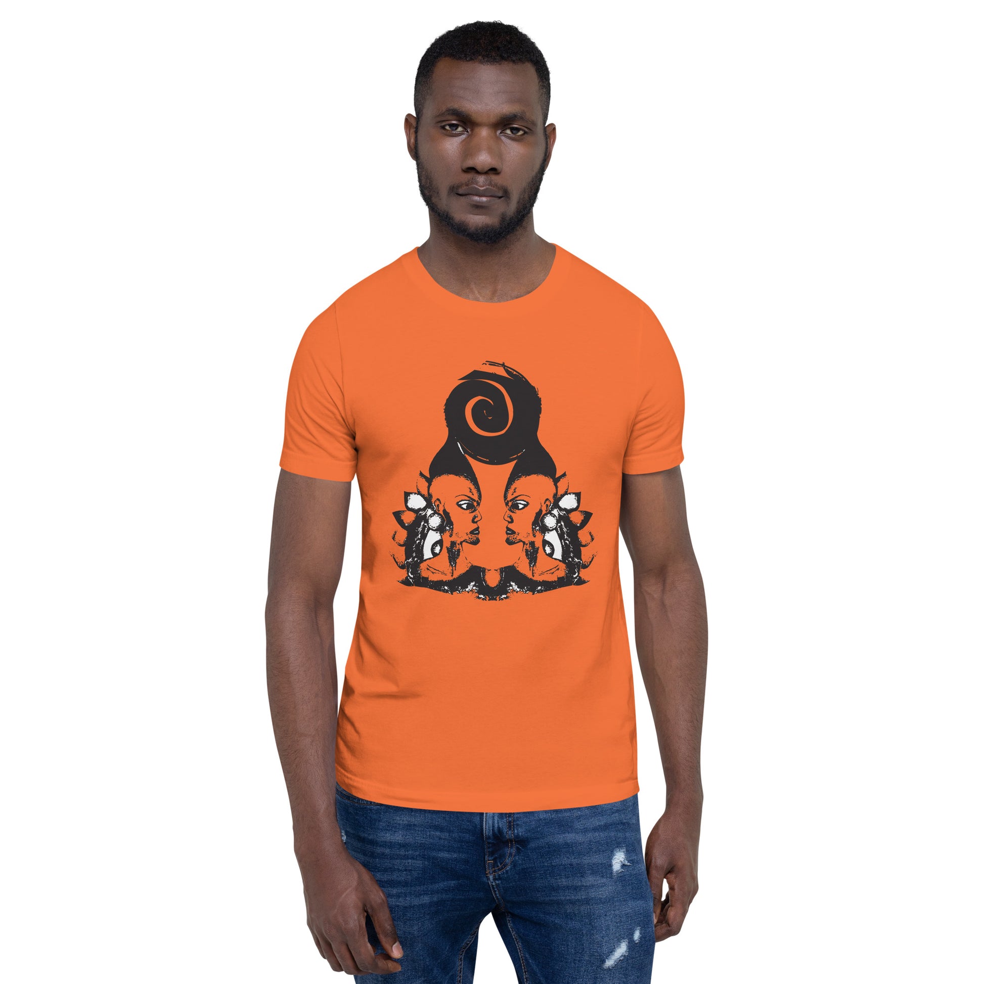 A male model wearing orange t-shirt featuring a hand-drawn black ink design of two mirrored female figures with bold, intricate headpieces, connected by a swirling central element. This artistic piece from K.L.O.E. embraces cultural inspiration and self-expression, crafted for those who appreciate unique, expressive fashion and modern bohemian style.