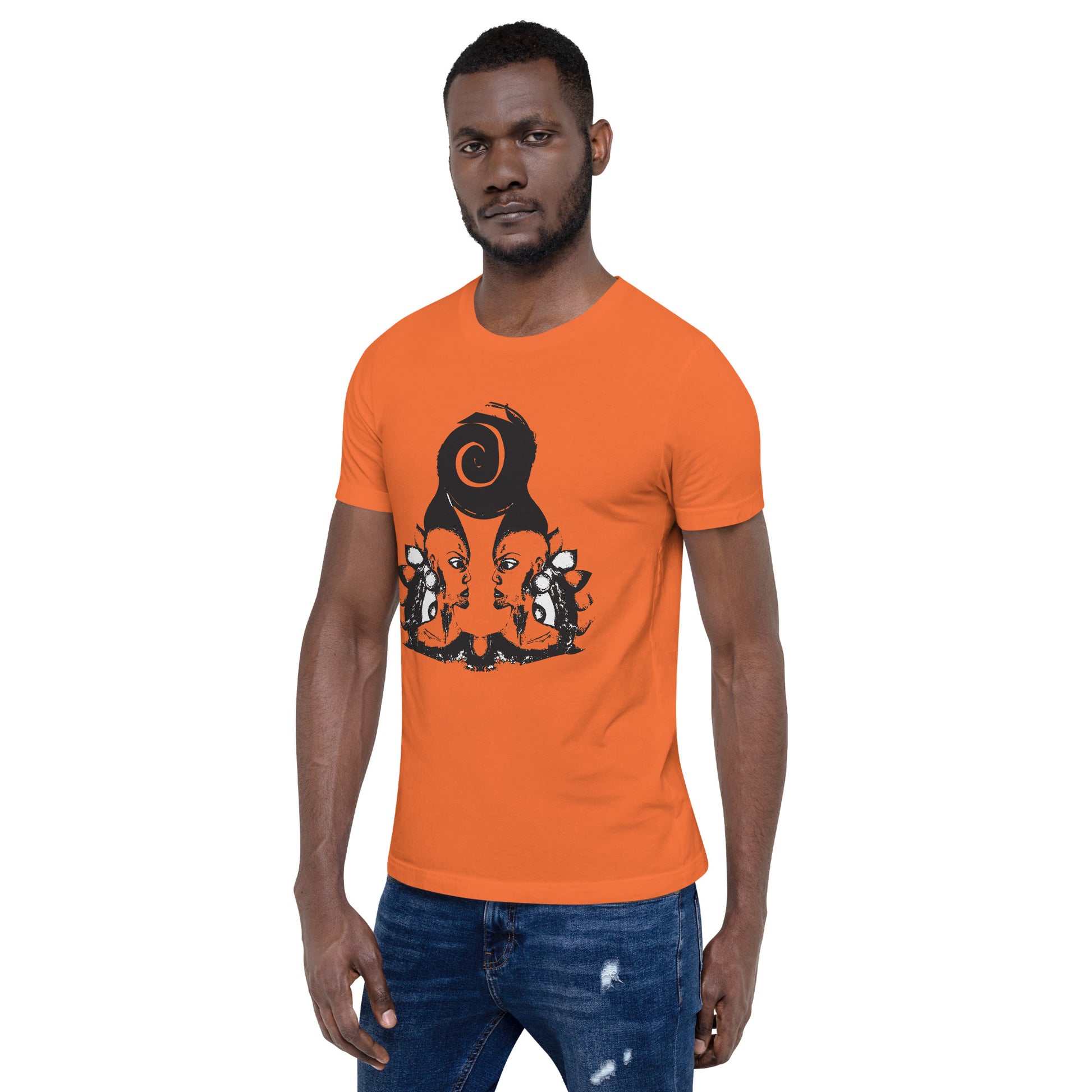 A male model wearing orange t-shirt featuring a hand-drawn black ink design of two mirrored female figures with bold, intricate headpieces, connected by a swirling central element. This artistic piece from K.L.O.E. embraces cultural inspiration and self-expression, crafted for those who appreciate unique, expressive fashion and modern bohemian style.