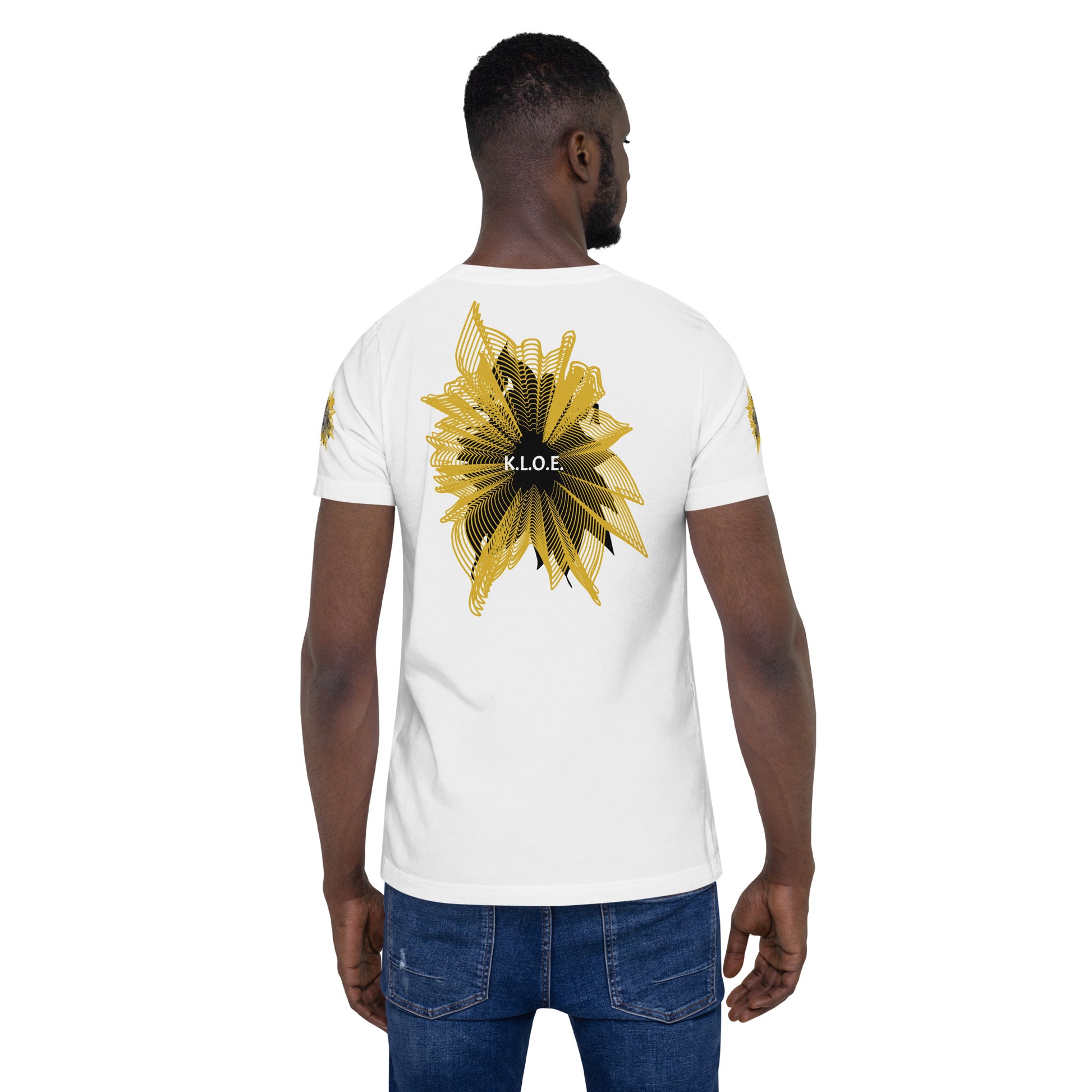 Back view of a white K.L.O.E. T-shirt showcasing a bold hand-drawn golden abstract sunburst design with black accents and the K.L.O.E. logo—an artistic and empowering piece of culturally inspired, handcrafted fashion that blends modern boho style with expressive women’s apparel, celebrating individuality and self-expression, on a model.