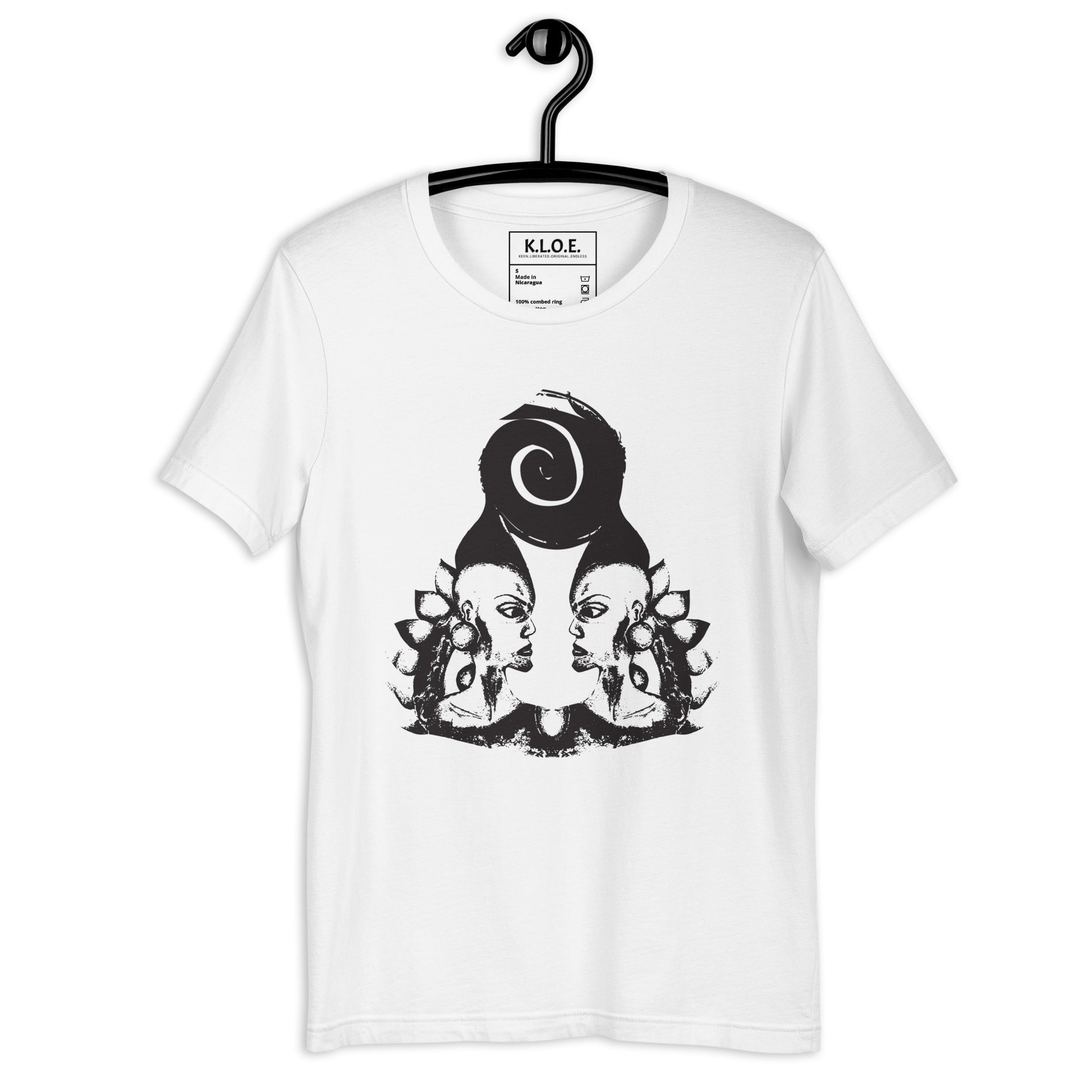 White t-shirt, on a hanger, featuring wearable illustrations with an art-inspired black design of mirrored female faces and a bold central spiral symbol, celebrating expressive fashion and individuality – unique clothing by K.L.O.E.