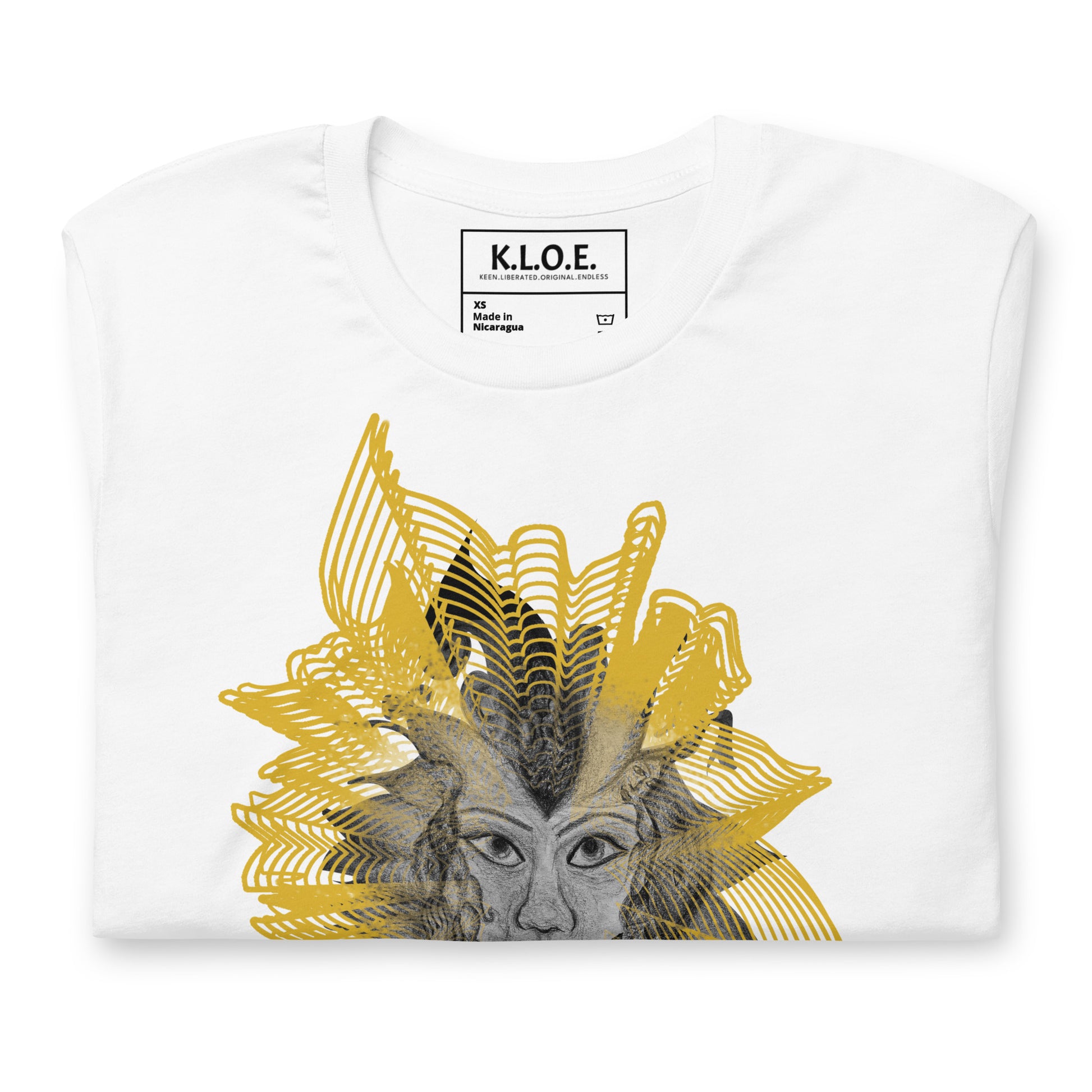 Detail view of the front side of a white K.L.O.E. T-shirt featuring a striking hand-drawn face design surrounded by radiant golden abstract patterns—an artistic and empowering piece of handcrafted fashion, blending bohemian style clothing with contemporary fashion for bold self-expression and individuality.