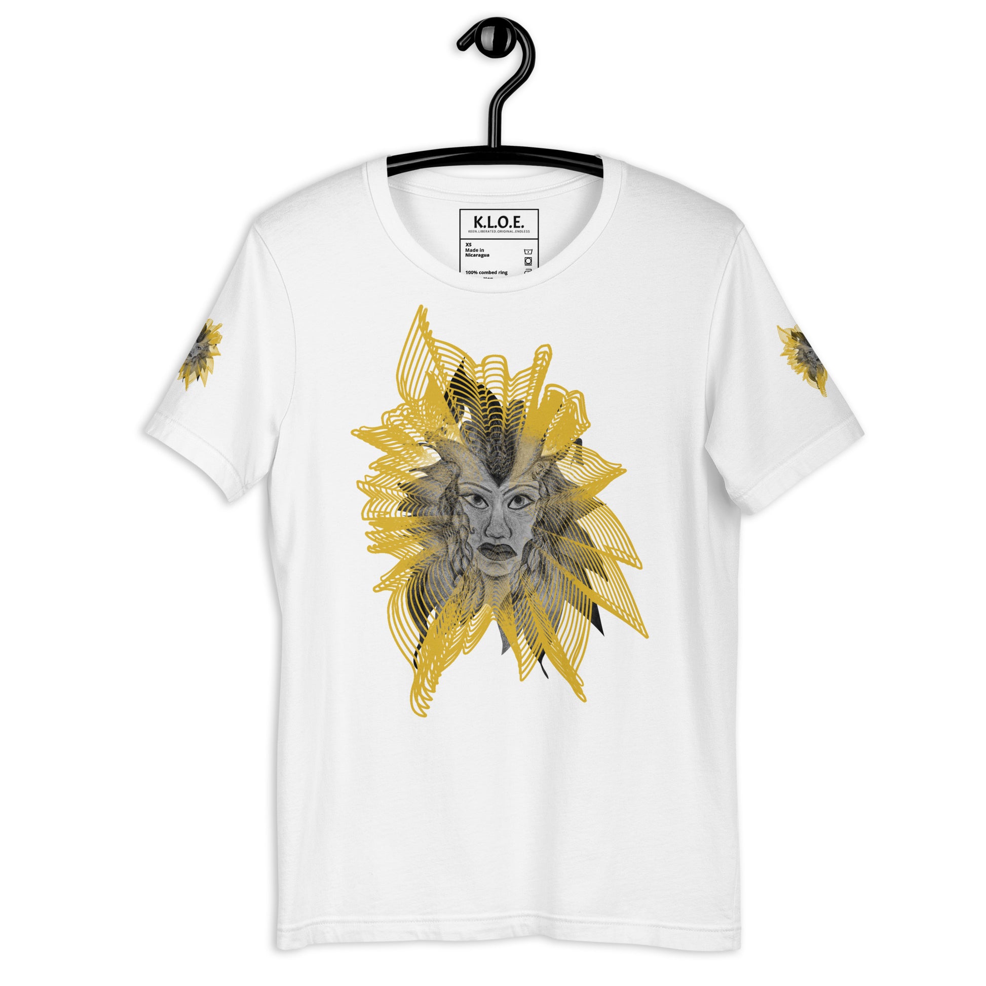Front view of a white K.L.O.E. T-shirt featuring a striking hand-drawn face design surrounded by radiant golden abstract patterns—an artistic and empowering piece of handcrafted fashion, blending bohemian style clothing with contemporary fashion for bold self-expression and individuality, on a hanger.