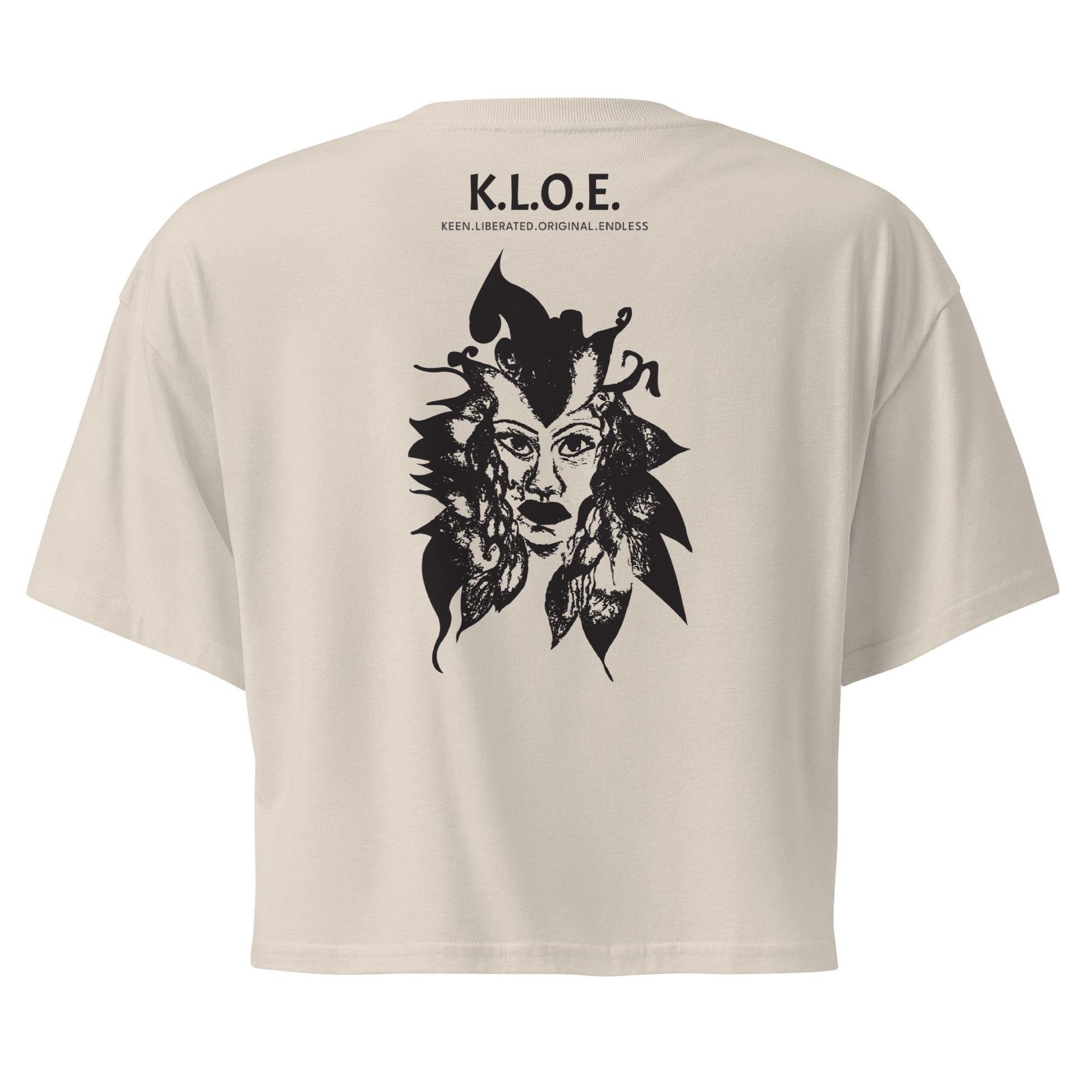 Back view of a bone K.L.O.E. crop t-shirt showcasing a culturally inspired, hand-drawn black design featuring a bold, expressive face intertwined with flowing, abstract patterns, and K.L.O.E. logo, embodying artistic self-expression and modern bohemian style fashion.