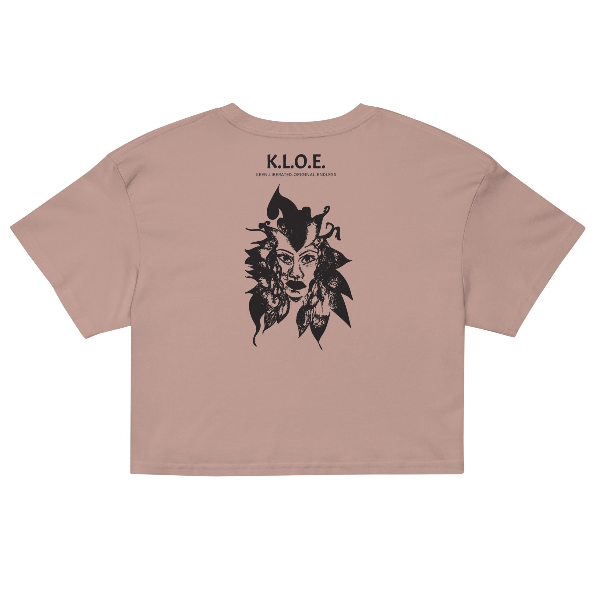 Back view of a hazy pink K.L.O.E. crop t-shirt showcasing a culturally inspired, hand-drawn black design featuring a bold, expressive face intertwined with flowing, abstract patterns, and K.L.O.E. logo, embodying artistic self-expression and modern bohemian style fashion.