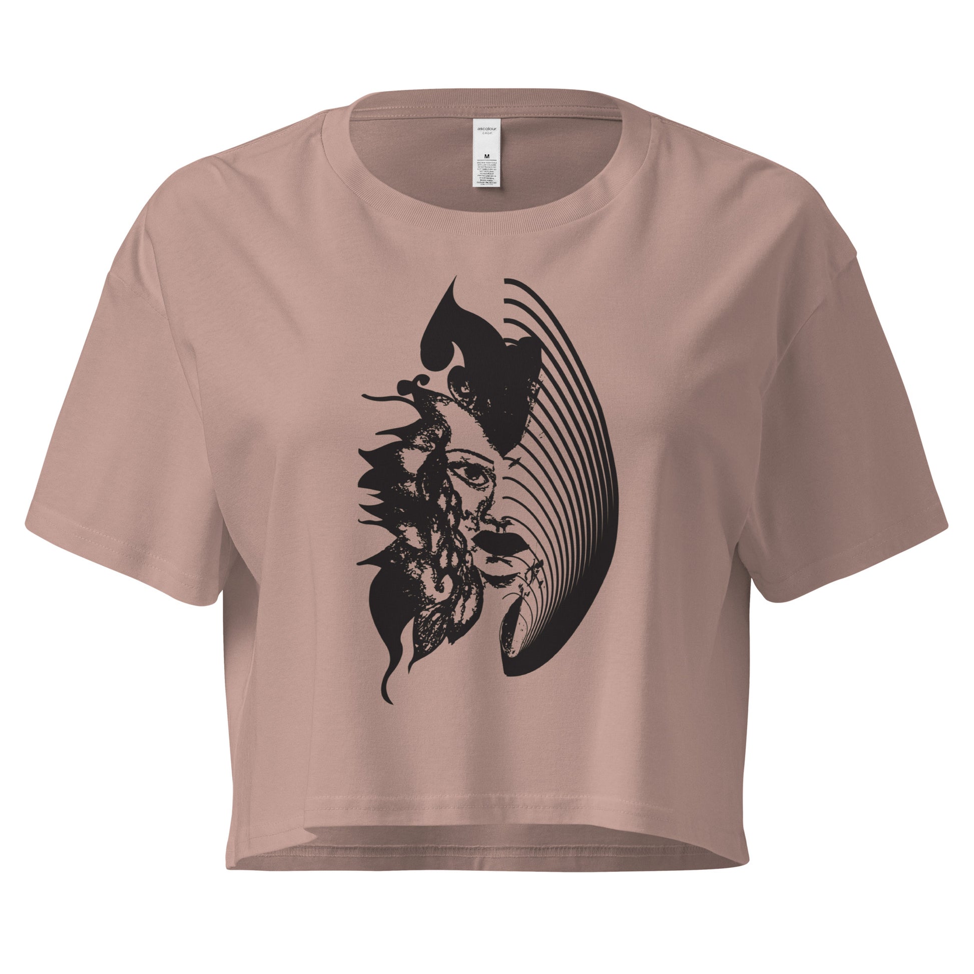 A hazy pink K.L.O.E. crop t-shirt featuring a culturally inspired, hand-drawn black graphic of a bold, expressive face surrounded by intricate details, celebrating individuality and artistic self-expression in modern bohemian style fashion.