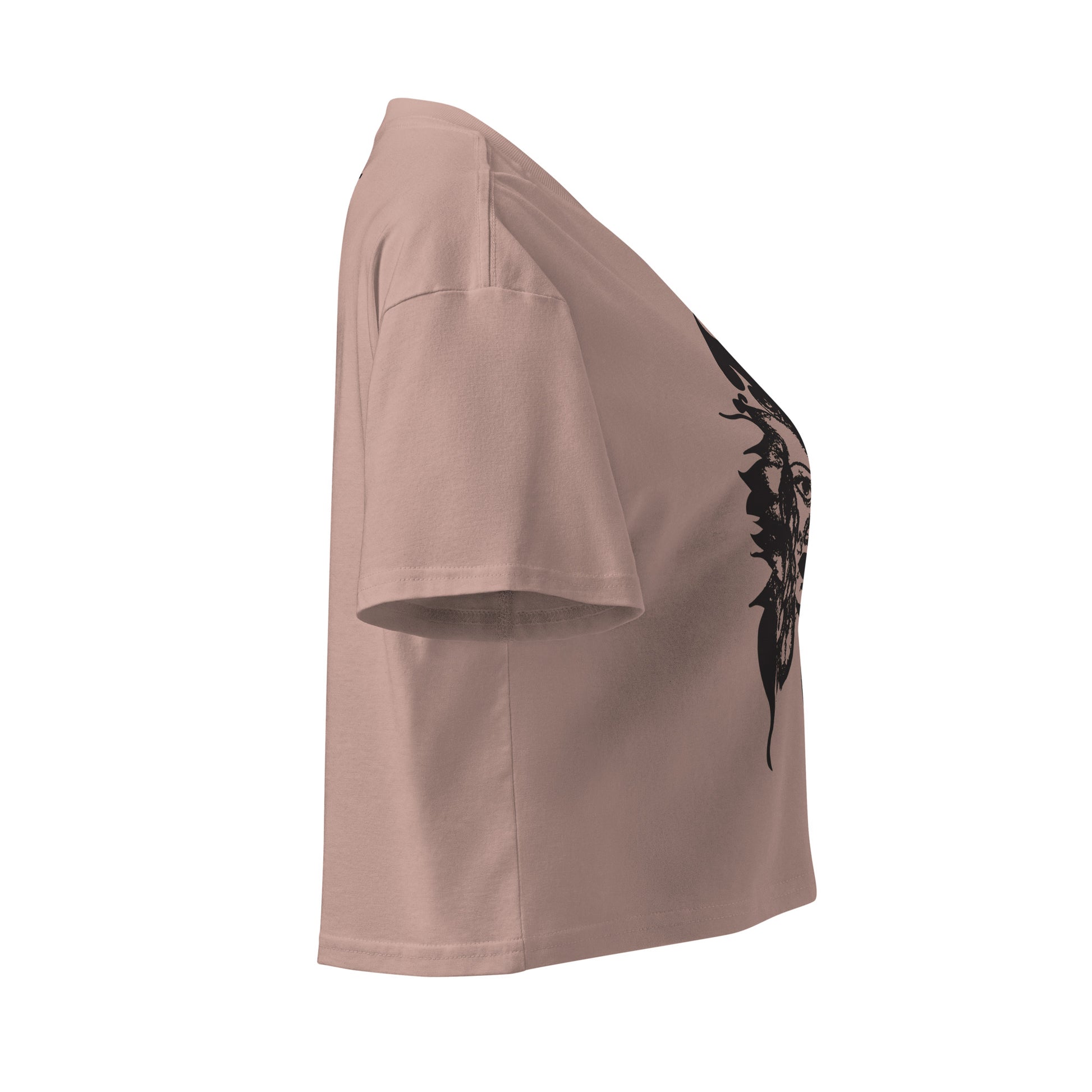 Side view of a hazy pink K.L.O.E. crop t-shirt featuring a culturally inspired, hand-drawn black graphic of a bold, expressive face surrounded by intricate details, celebrating individuality and artistic self-expression in modern bohemian style fashion.