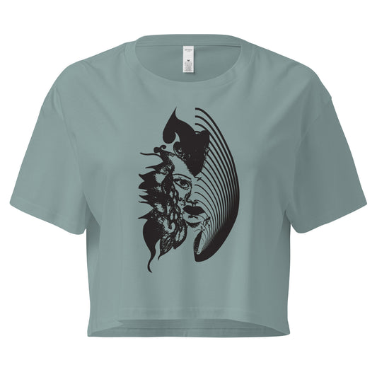 Mineral K.L.O.E. crop t-shirt featuring a culturally inspired, hand-drawn black graphic of a bold, expressive face surrounded by intricate details, celebrating individuality and artistic self-expression in modern bohemian style fashion.