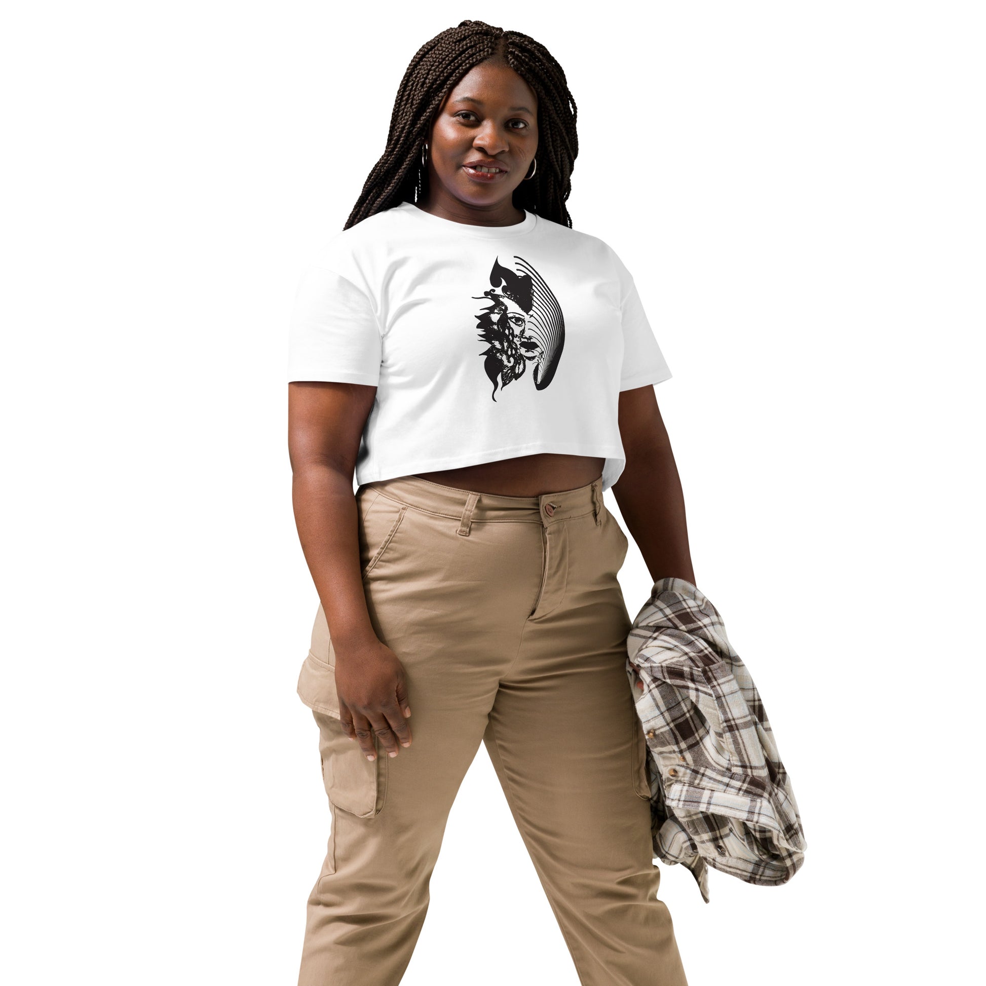 A model wearing white K.L.O.E. crop t-shirt featuring a culturally inspired, hand-drawn black graphic of a bold, expressive face surrounded by intricate details, celebrating individuality and artistic self-expression in modern bohemian style fashion.