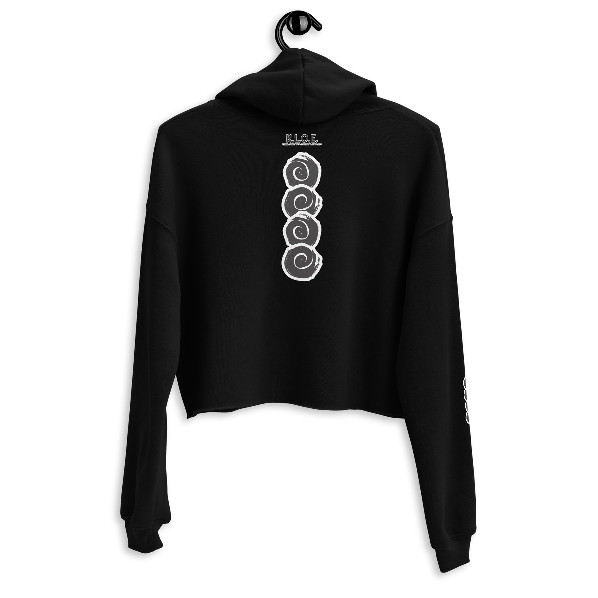 Back view of a black cropped hoodie featuring a vertical row of three hand-drawn white spirals in a bold, brushstroke style. This unique, culturally inspired design from K.L.O.E. embodies modern boho style and artistic expression, ideal for those seeking eco-friendly, artisan fashion with a contemporary edge.